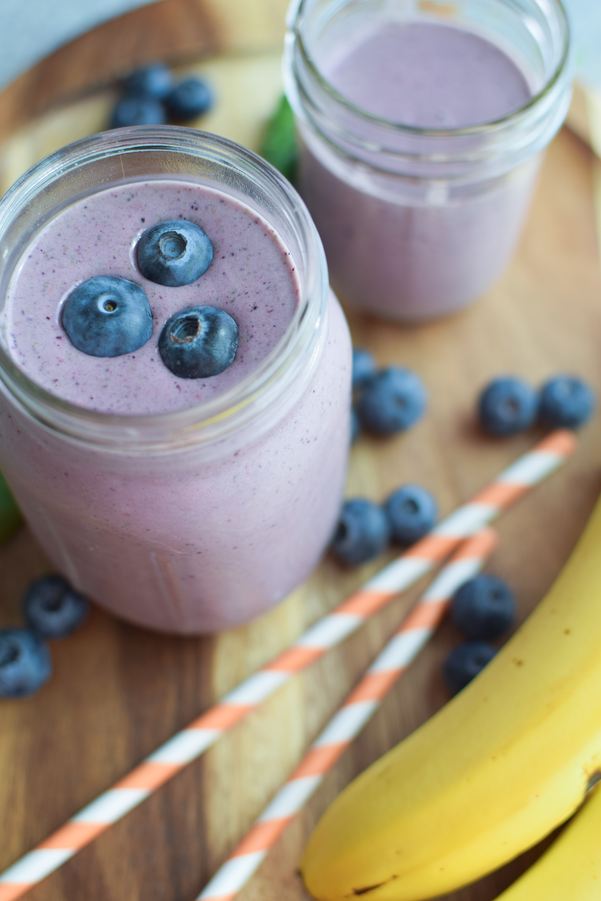 Our very favorite go-to Berry Protein Smoothies recipe in two ways! Packed with berries, greens, and protein, and super easy for meal prepping! - pmp.local