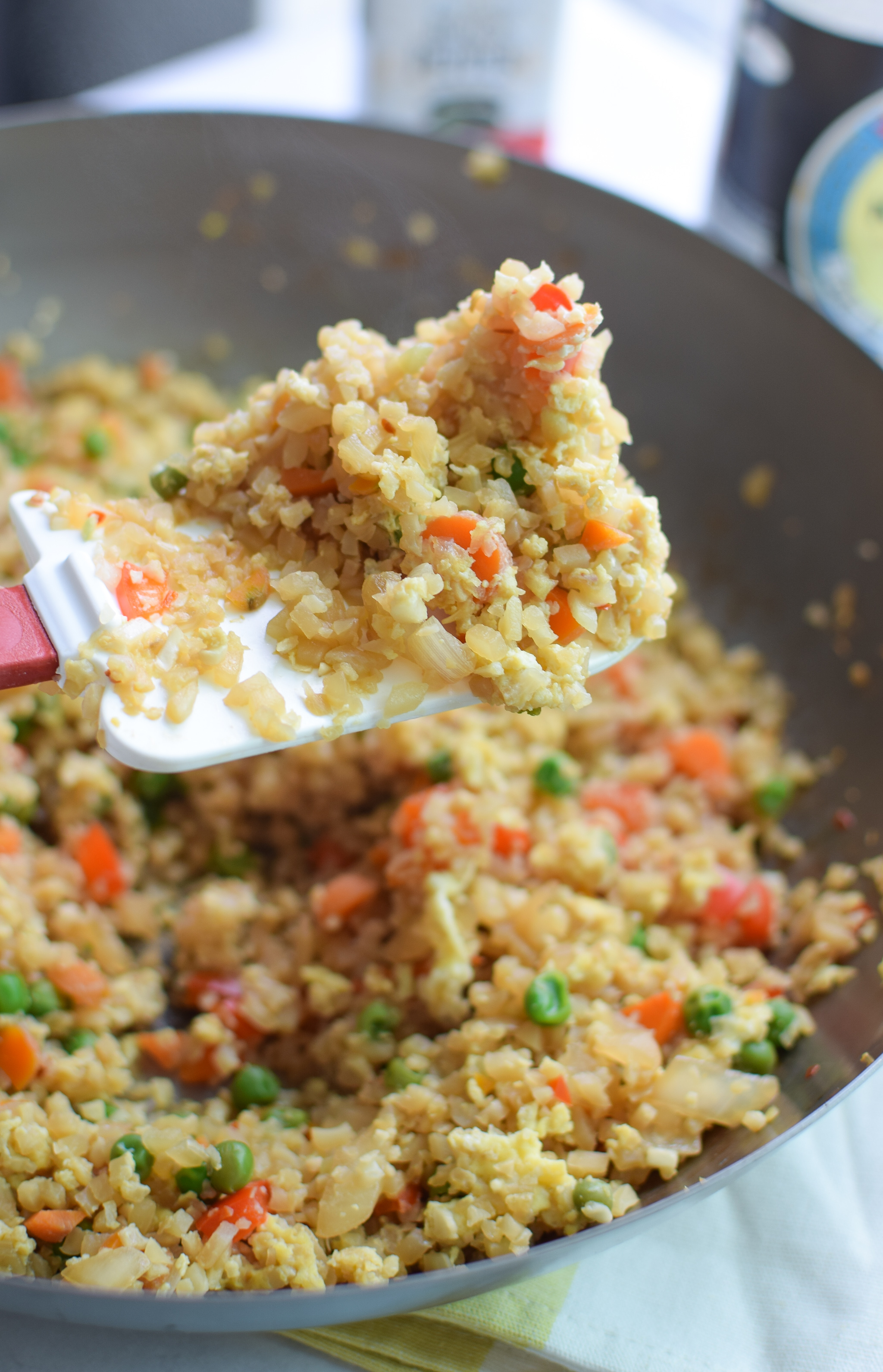Fried Cauliflower Rice Recipe - Super healthy takeout style fried "rice", made with cauliflower! Packed with veggies and easy to personalize. - pmp.local