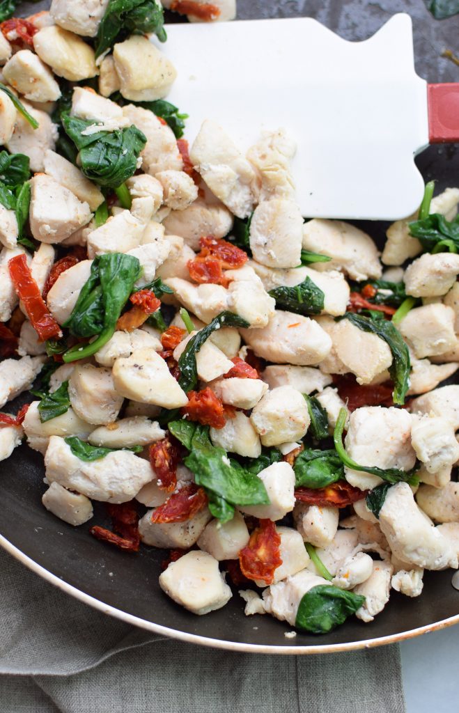 chicken and spinach mixture cooked for the pesto chicken stuffed spaghetti squash.