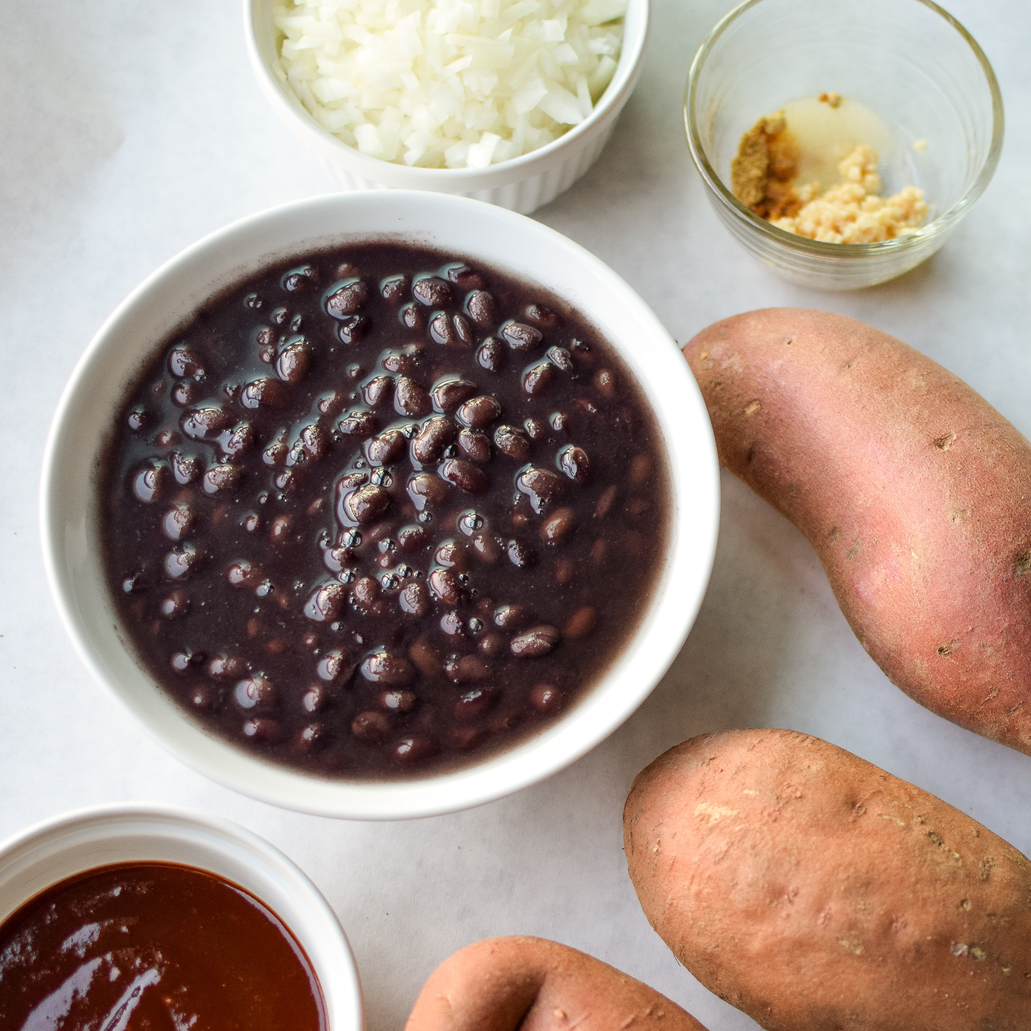 BBQ Black Bean Slow Cooker Sweet Potatoes - Black beans, sweet potatoes, and spicy BBQ sauce. A match made in side dish heaven! - pmp.local