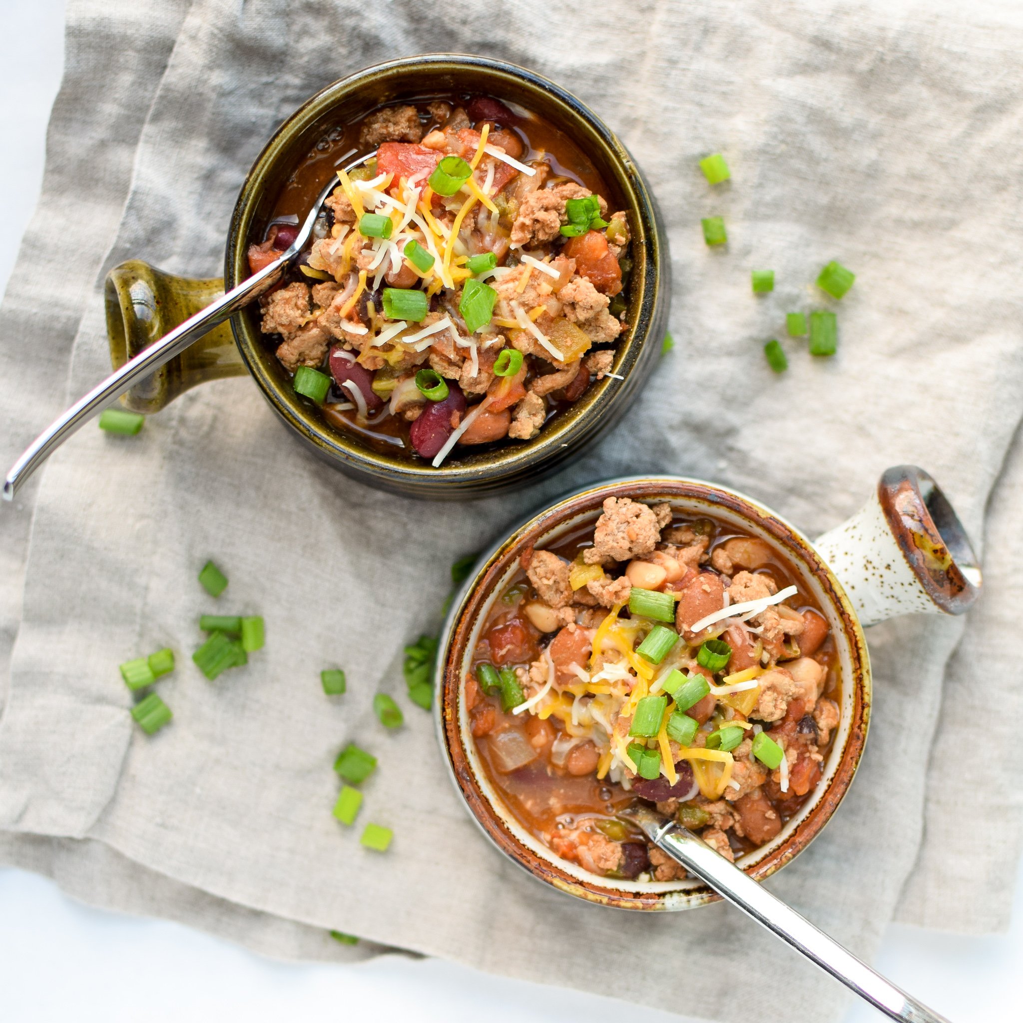Easy Slow Cooker 4-Bean Turkey Chili recipe - A slow cooker classic that should be in everyone's cookbook! A hearty bean and turkey chili with some smokey kick! - pmp.local