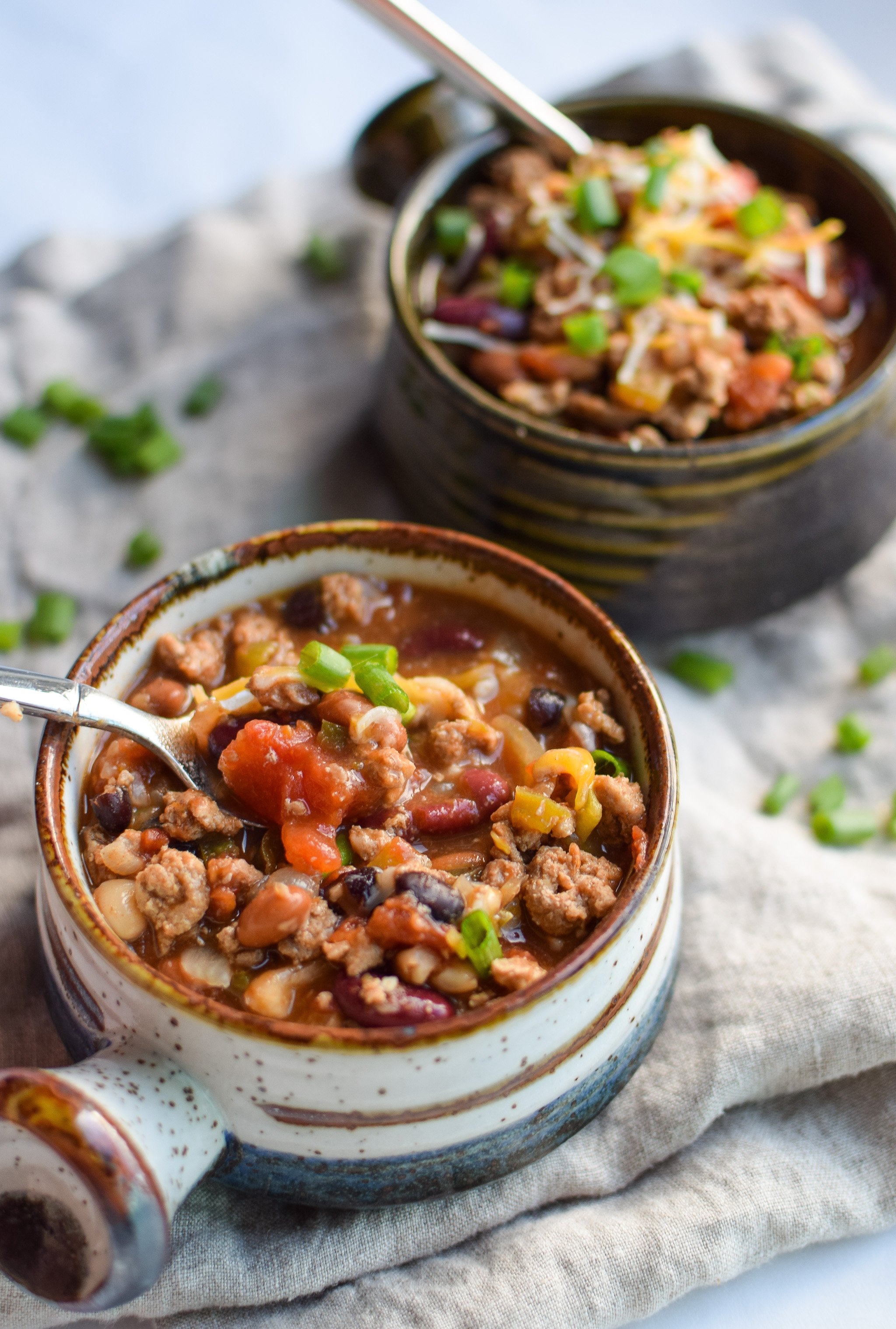 Easy Slow Cooker 4-Bean Turkey Chili recipe - A slow cooker classic that should be in everyone's cookbook! A hearty bean and turkey chili with some smokey kick! - pmp.local