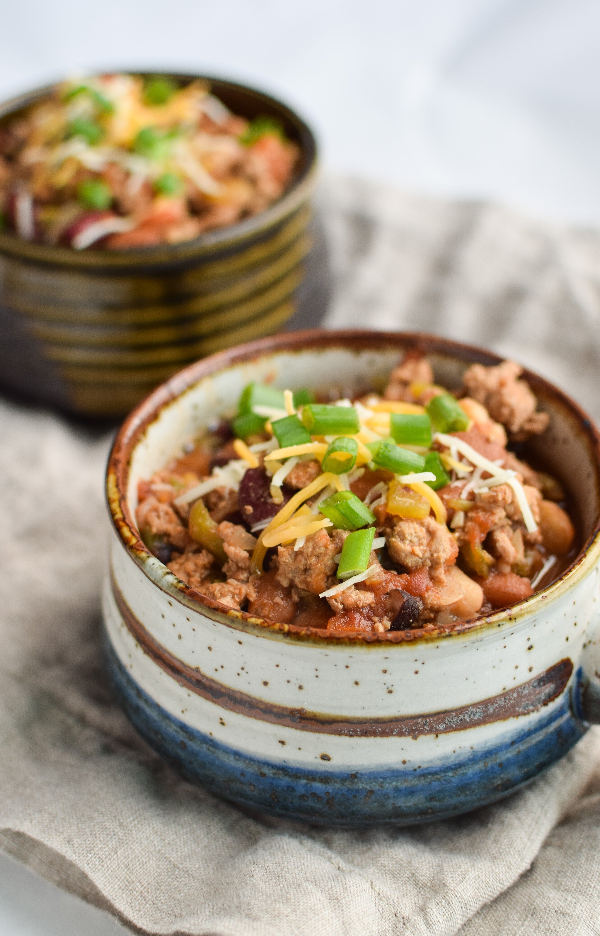 Easy Slow Cooker 4-Bean Turkey Chili recipe - A slow cooker classic that should be in everyone's cookbook! A hearty bean and turkey chili with some smokey kick! - pmp.local