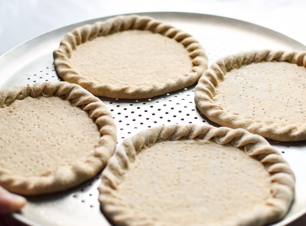 How To Make Trader Joe's Pizza Dough Into Freezer Friendly Premade Pizza Crusts - Four mini pizza crusts in the freezer for emergencies!! Using SUPER cheap Trader Joe's dough! - pmp.local
