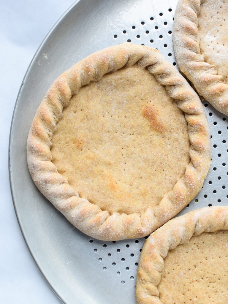 How To Make Trader Joe's Pizza Dough Into Freezer Friendly Premade Pizza Crusts - Four mini pizza crusts in the freezer for emergencies!! Using SUPER cheap Trader Joe's dough! - pmp.local