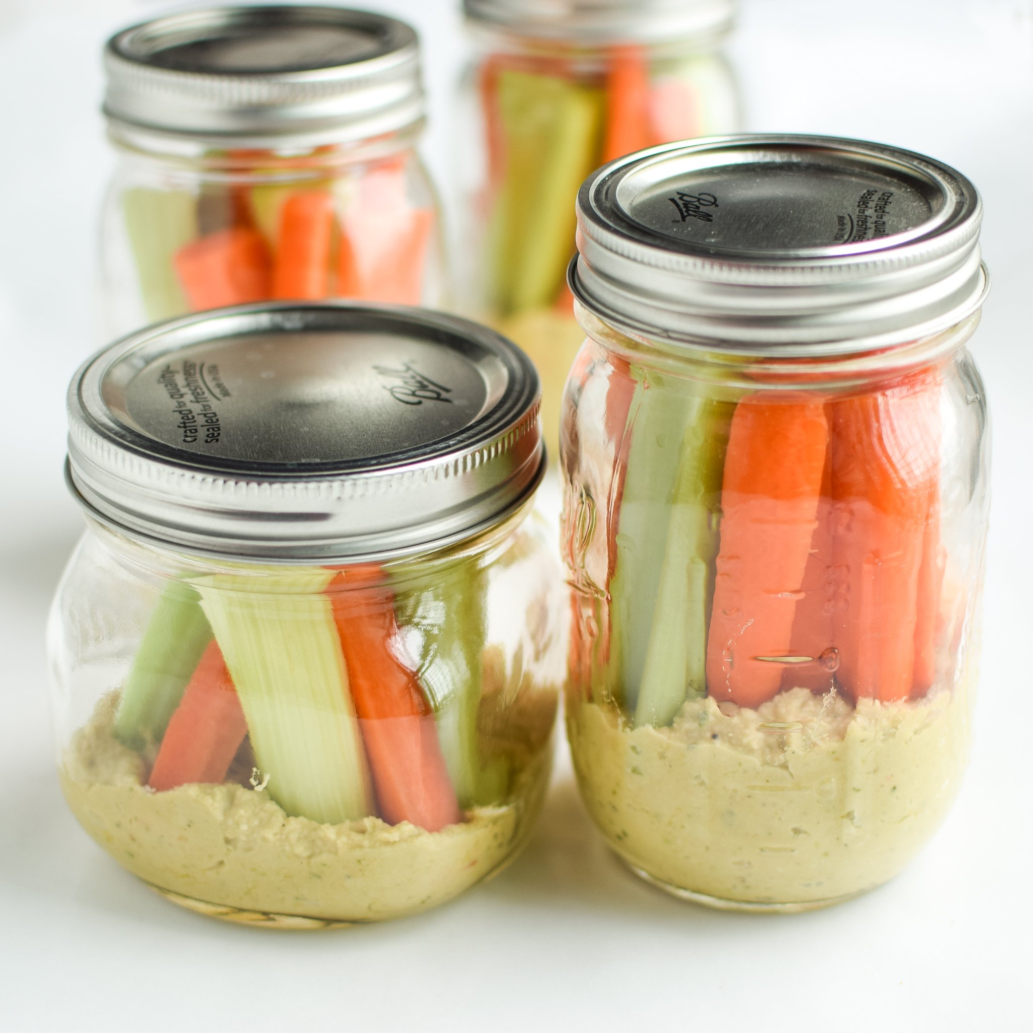 Snack Prep: Veggie Sticks with Easy Pesto Hummus recipe - A pesto twist on the classic hummus, plus, have you tried it with veggies in a mason jar? - pmp.local