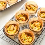 These Southwest Muffin Tin Hash Brown Egg Cups are perfect for your breakfast meal prep! Southwest hash browns with veggies, cheese, scrambled eggs, and a tiny dose of chipotle Tabasco! - pmp.local