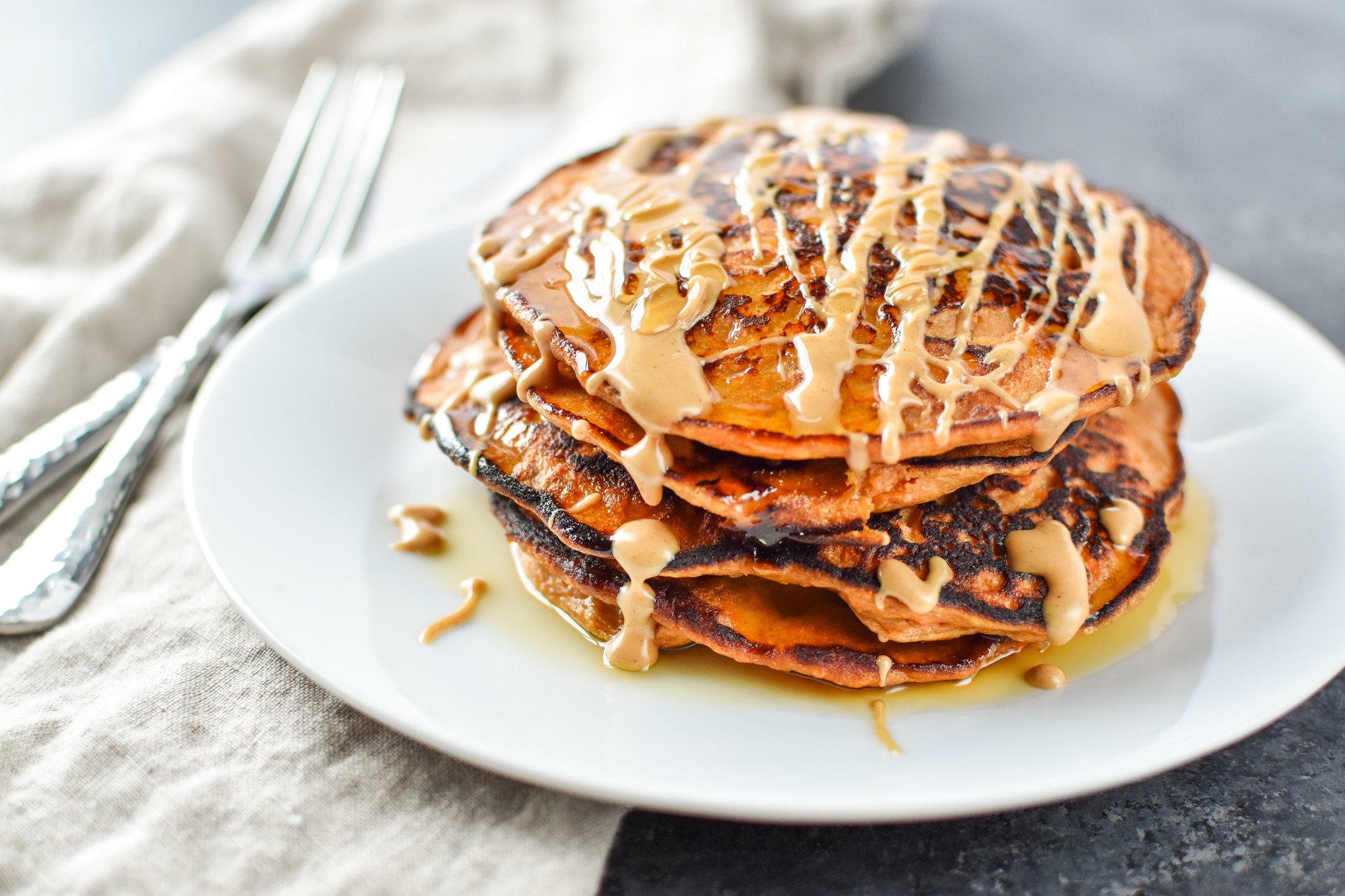 5-Ingredient Sweet Potato Banana Pancakes - Banana, sweet potato, nut butter, eggs and cinnamon are all you need to make these simple pancakes happen. - pmp.local