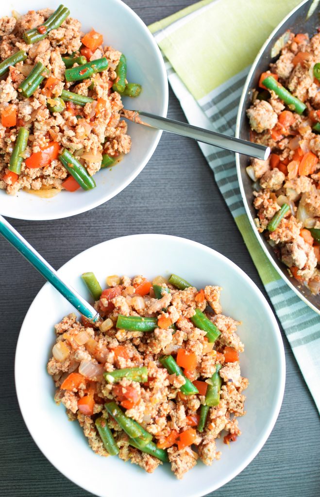 Servings of the Green Bean Turkey Skillet portioned into bowls from the skillet.