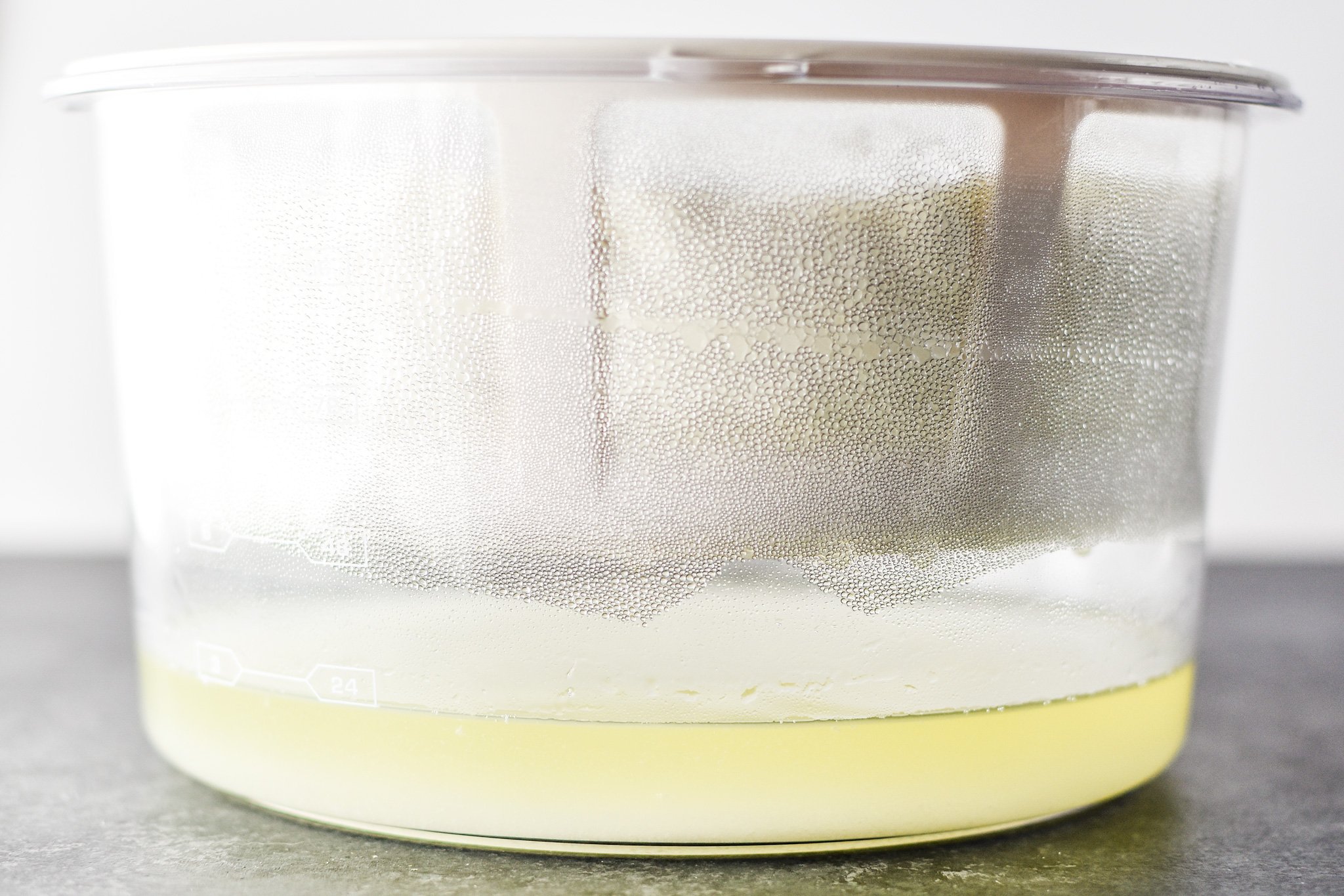 Yogurt that has been straining for a few hours with lots of whey drained off.