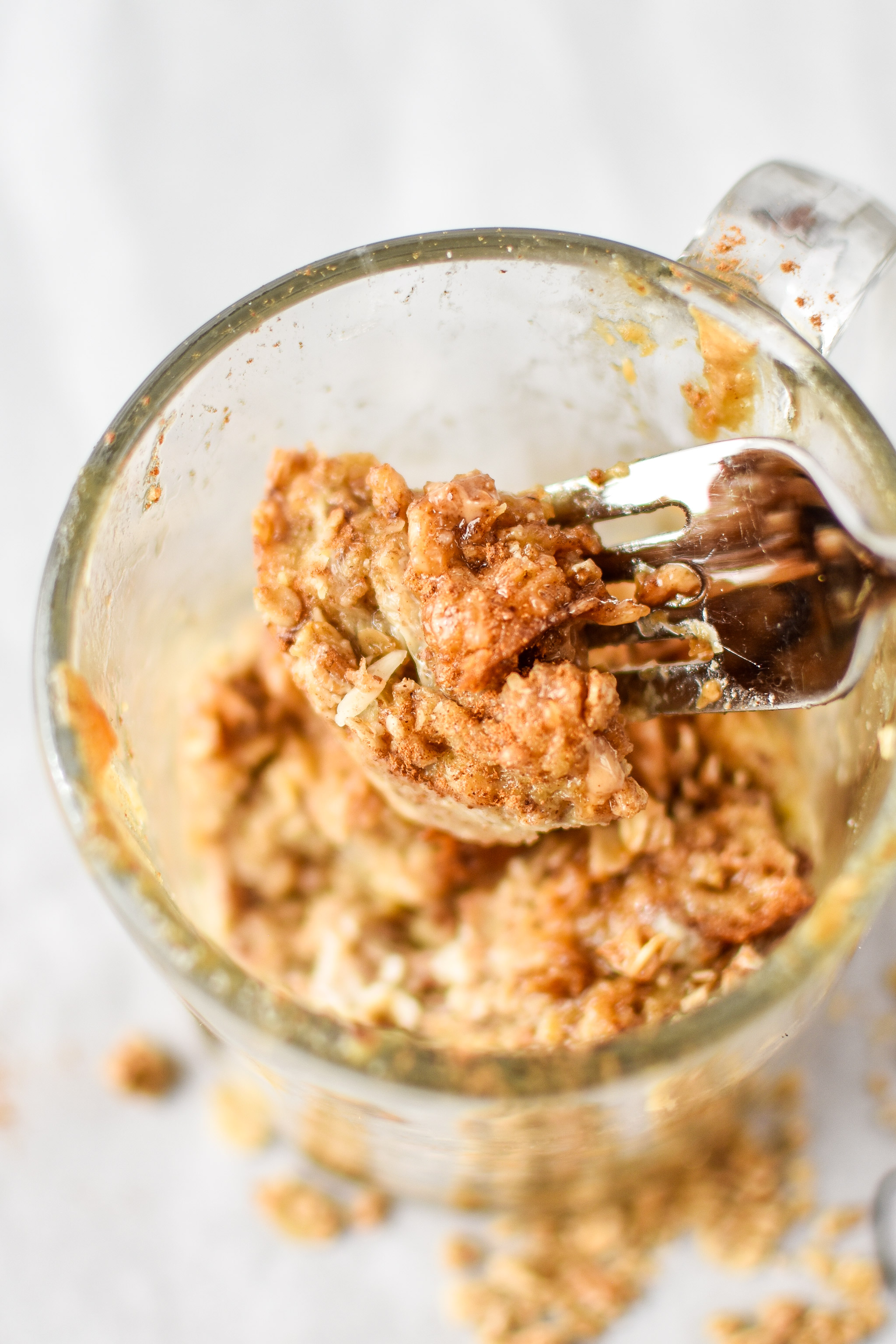 taking a bite of the microwave mug french toast