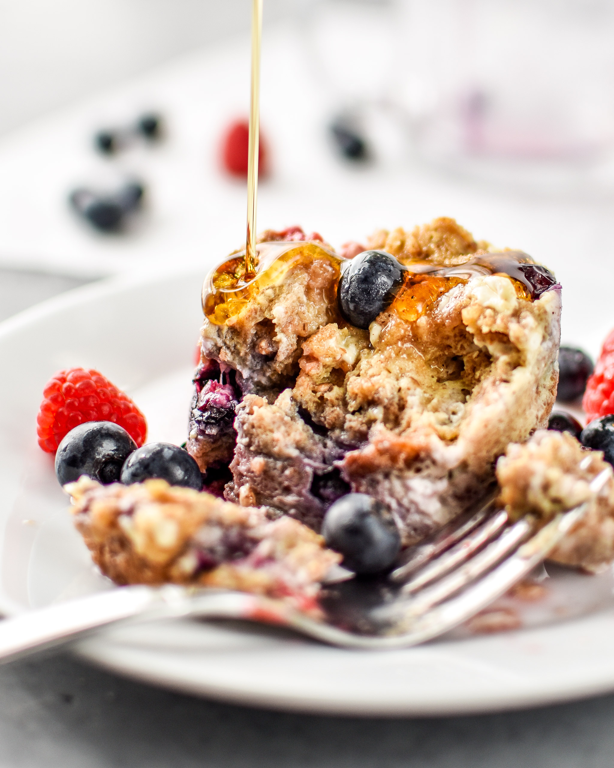 Microwave Mug French Toast after being cooked, plated and drizzled with maple syrup.