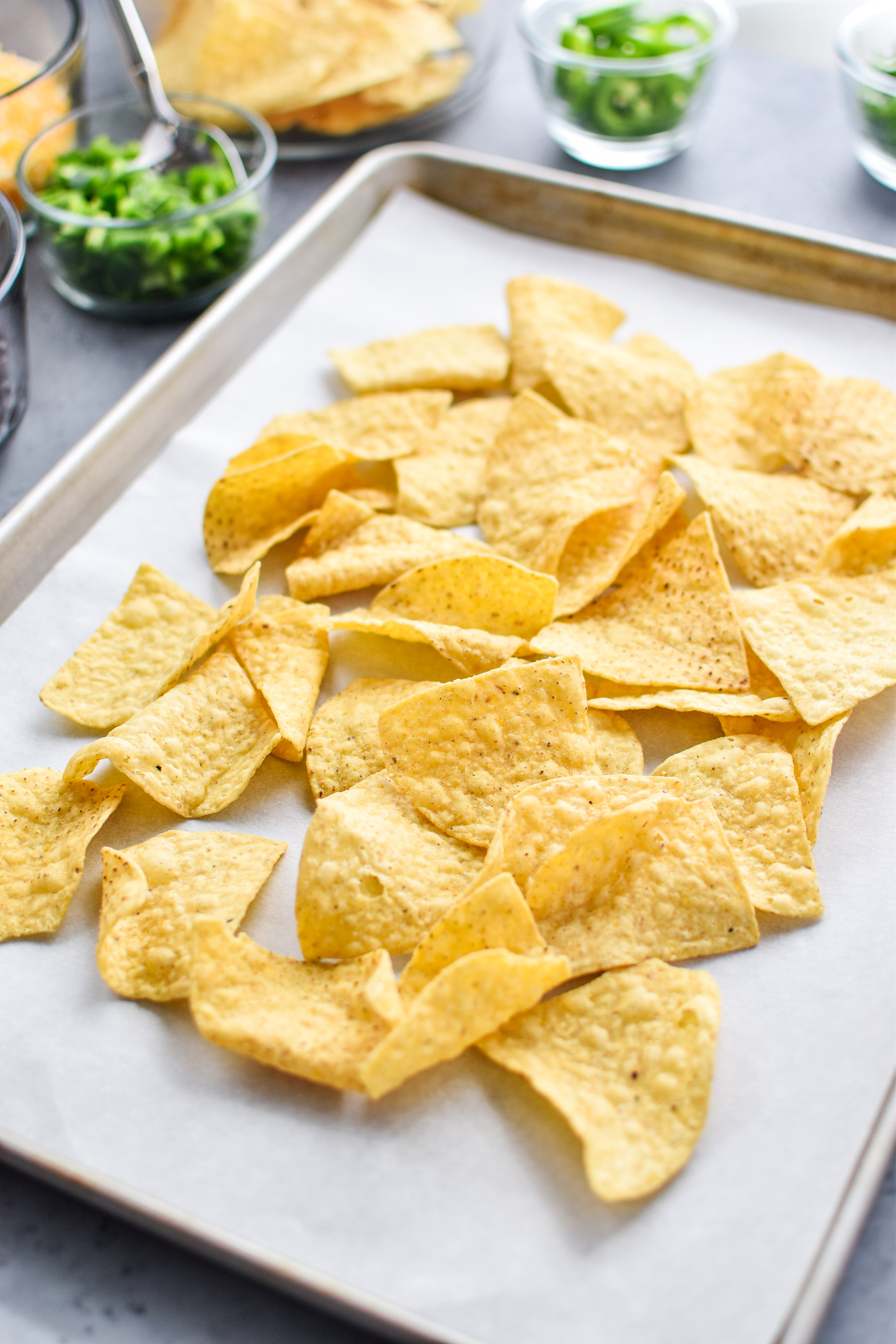 The first layer of the prep ahead rotisserie chicken nachos