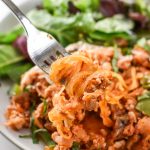 close up of spaghetti squash spaghetti bake on a fork.