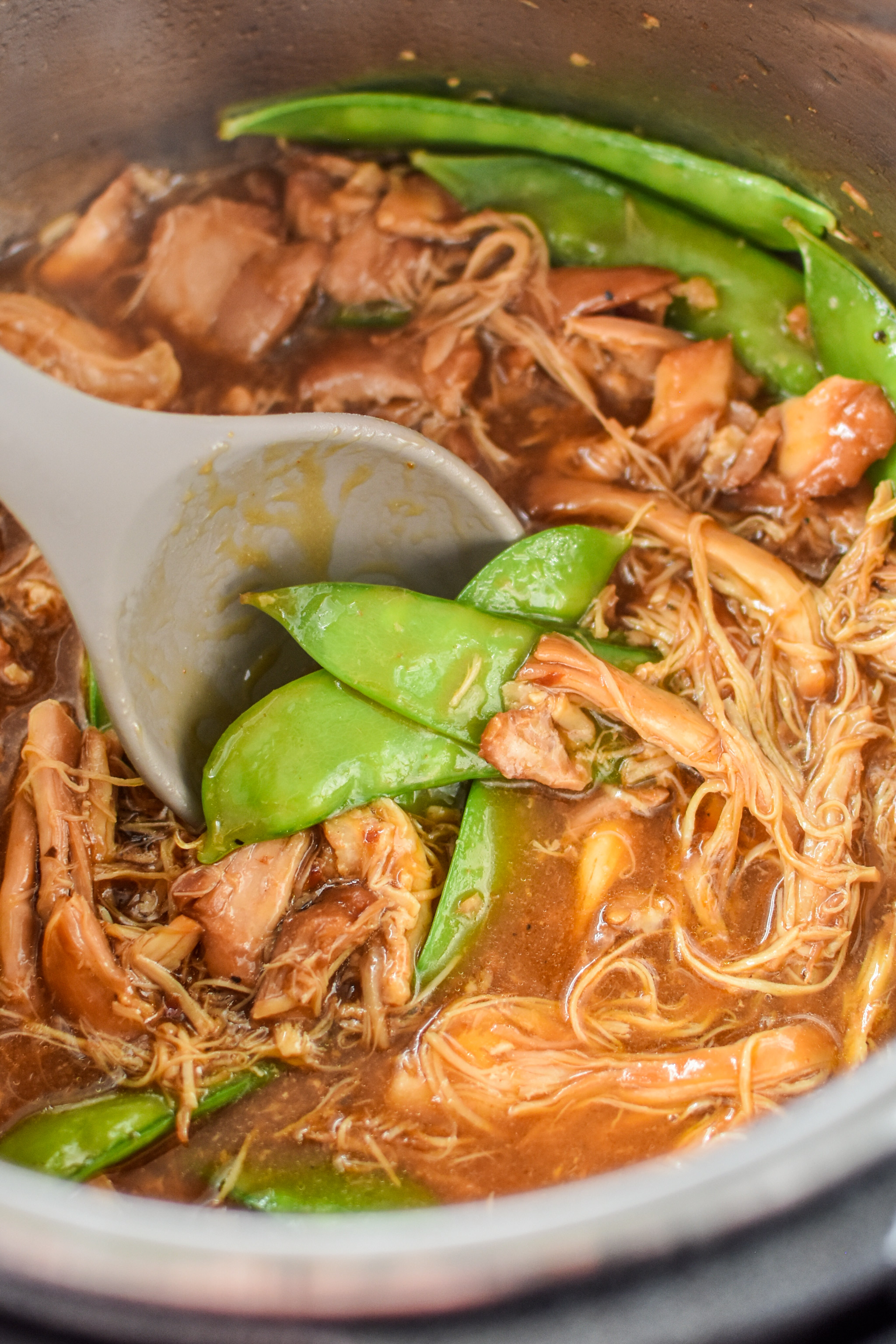 A spoonful of the Instant Pot Honey Garlic Chicken Meal Prep Bowls.