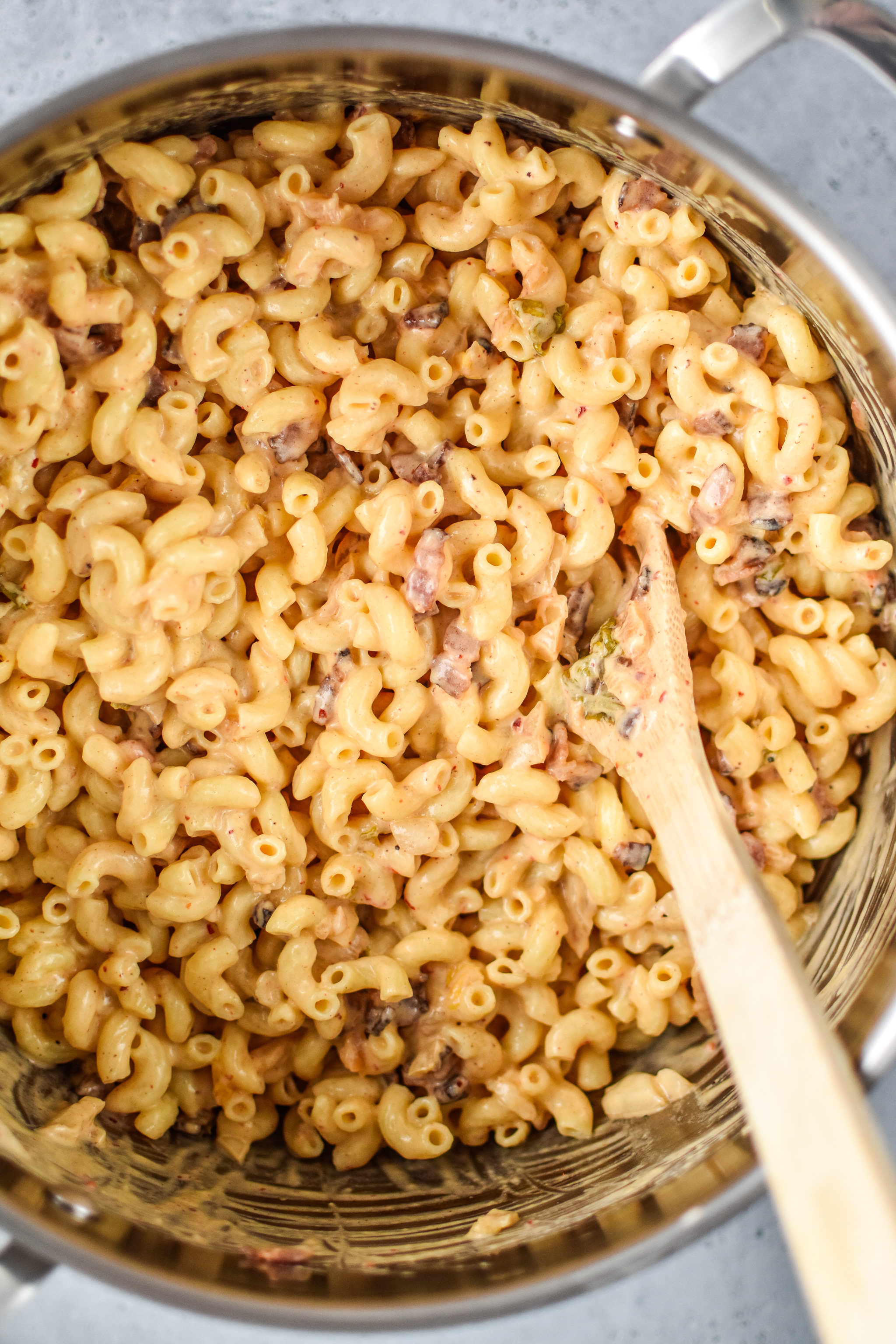 Process shots of cooking the kimchi bacon greek yogurt mac and cheese