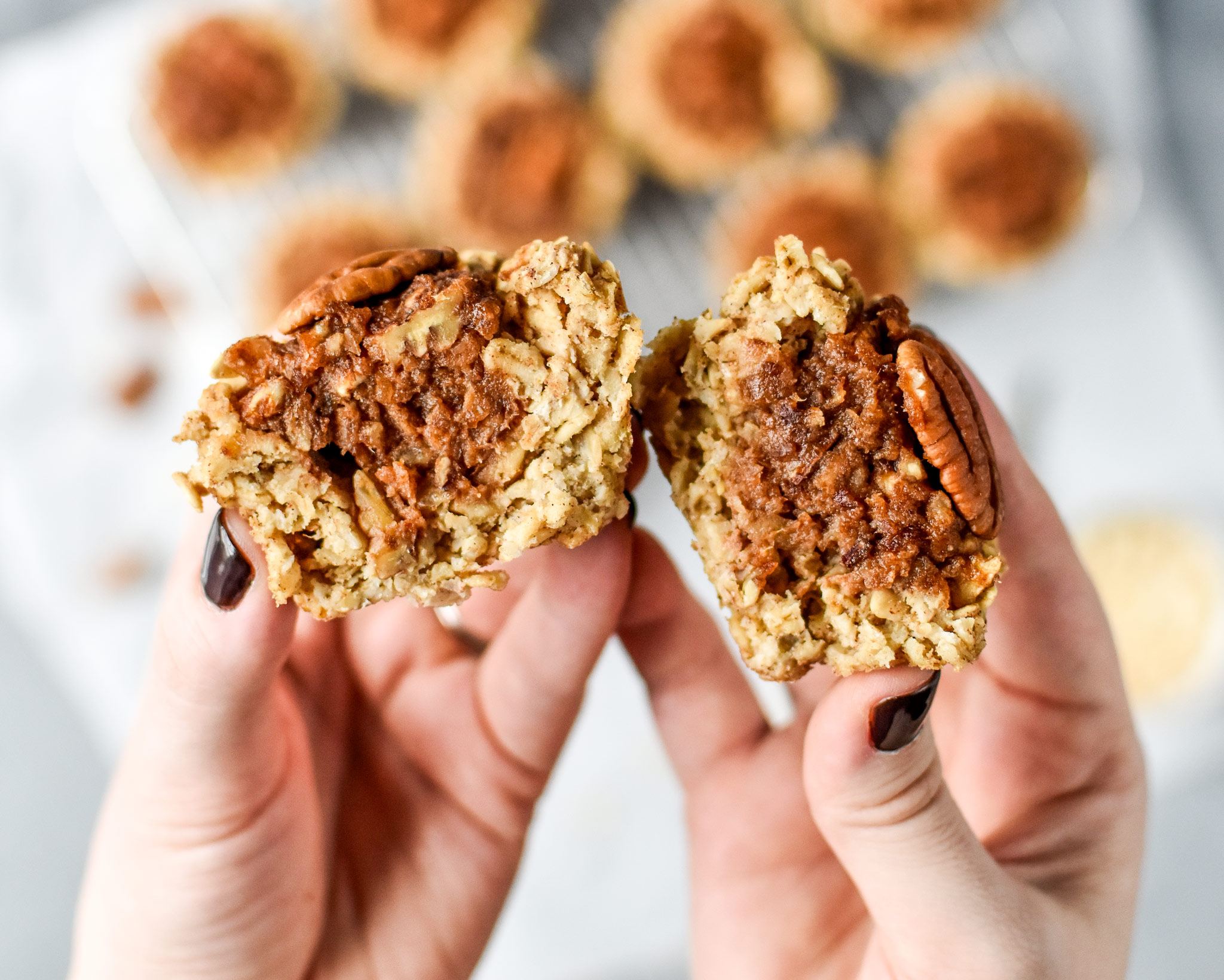 Pecan Pie Stuffed Oatmeal Breakfast Cups cut in half. 