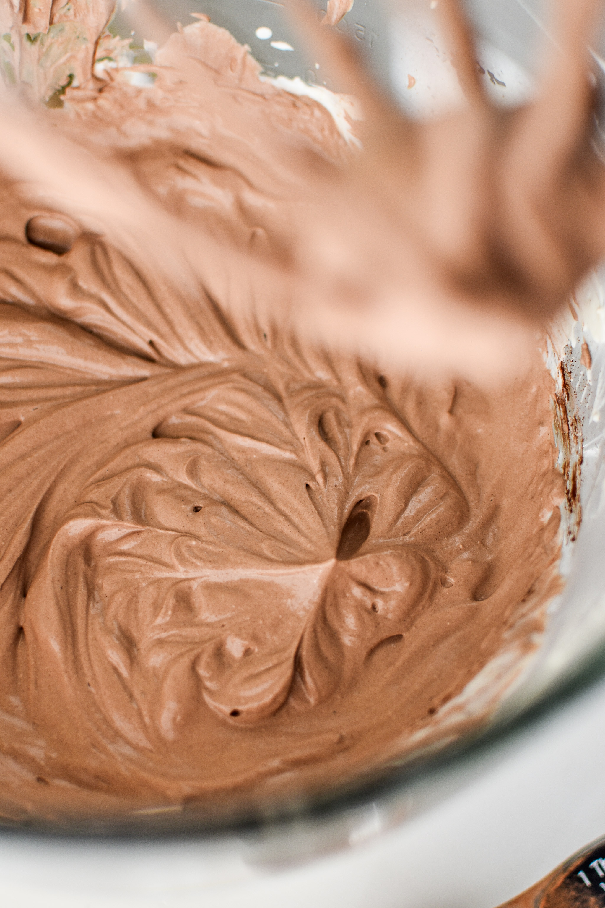 Freshly made peppermint chocolate whipped greek yogurt in a large bowl.