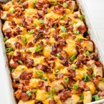 Chicken bacon ranch potato bake fresh from the oven in a rectangular dish.