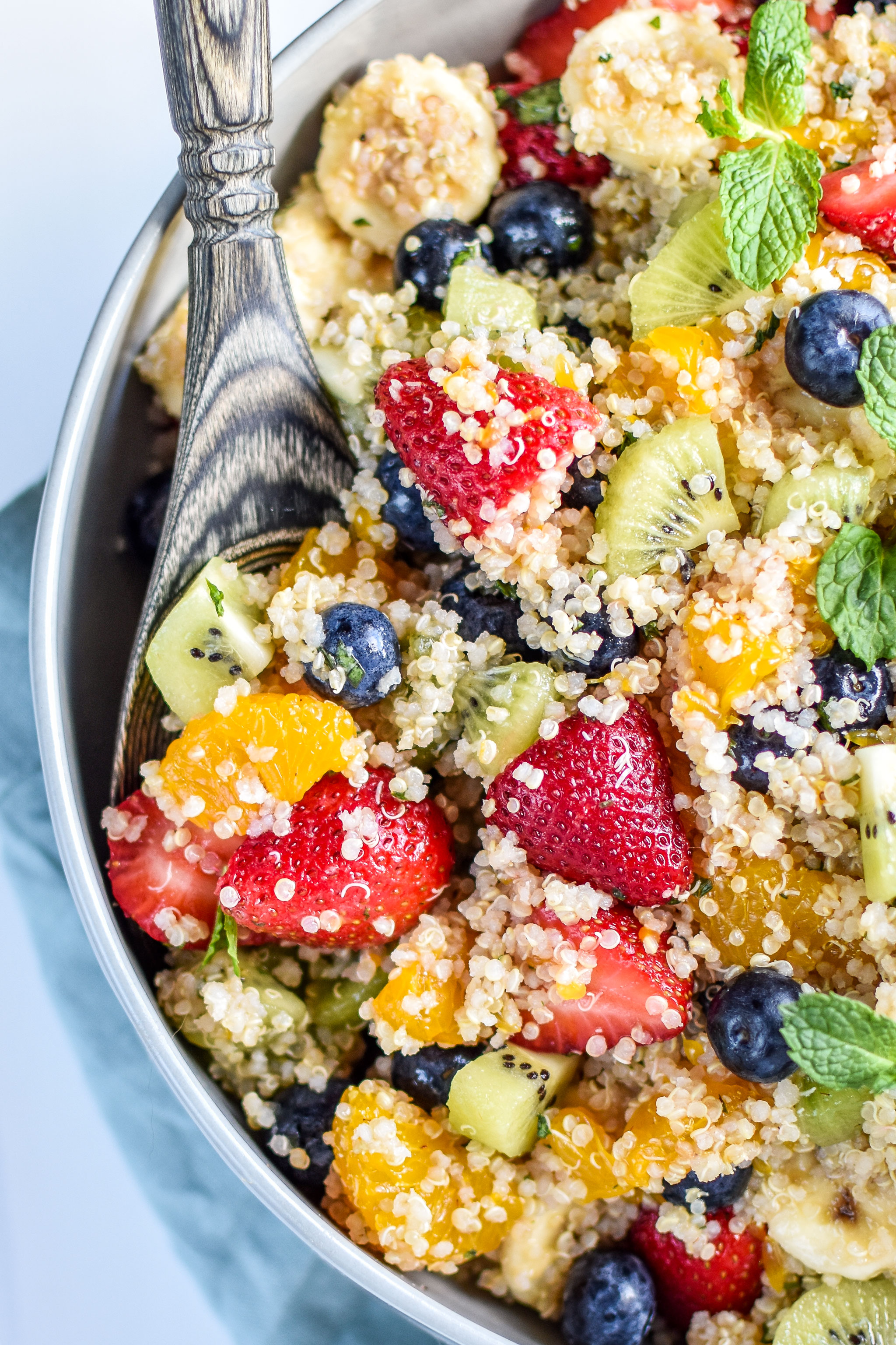 Mint Quinoa Fruit Salad full of berries, kiwi, bananas and mandarins
