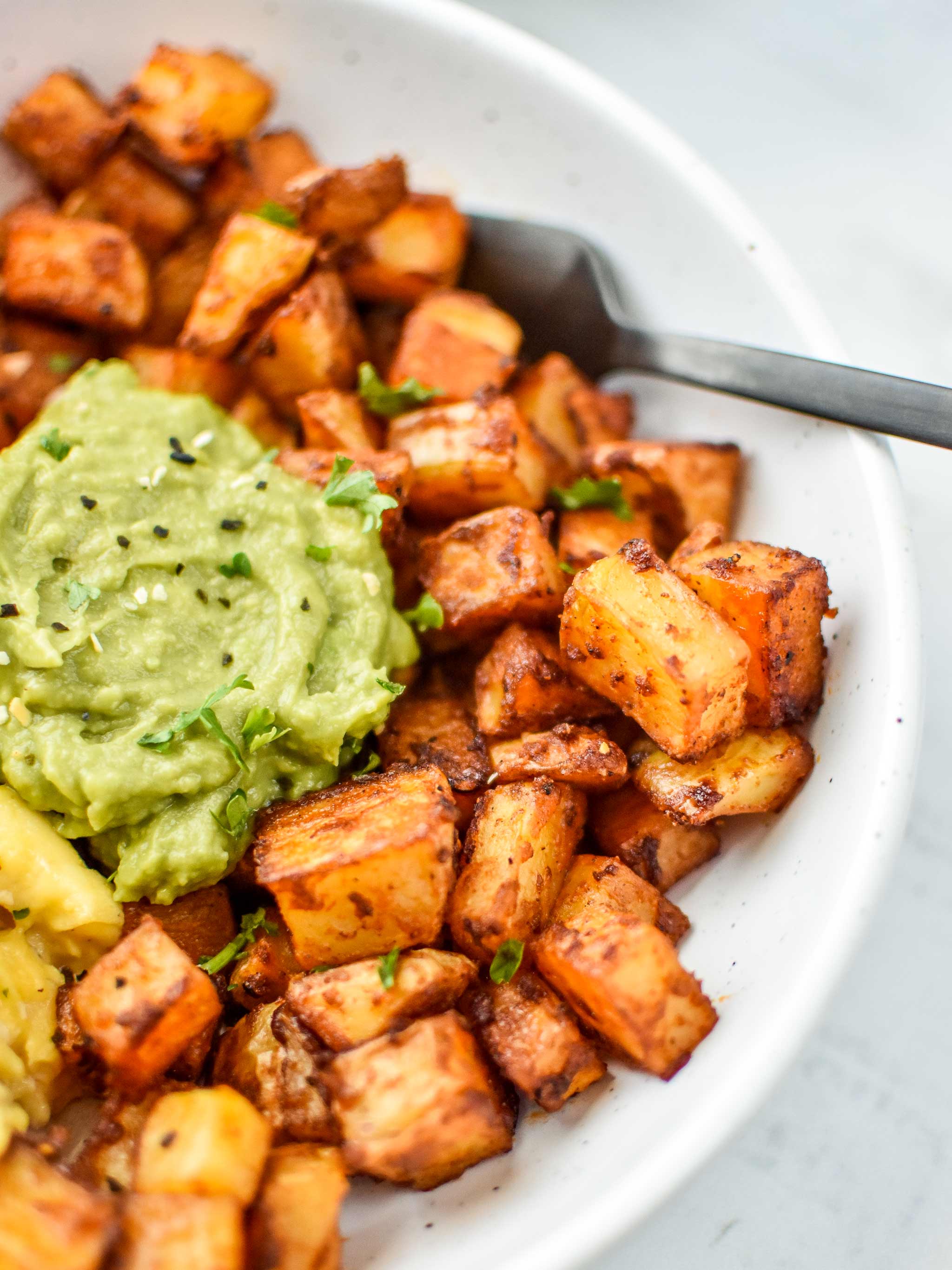 Basic oven breakfast potatoes with mashed avocado