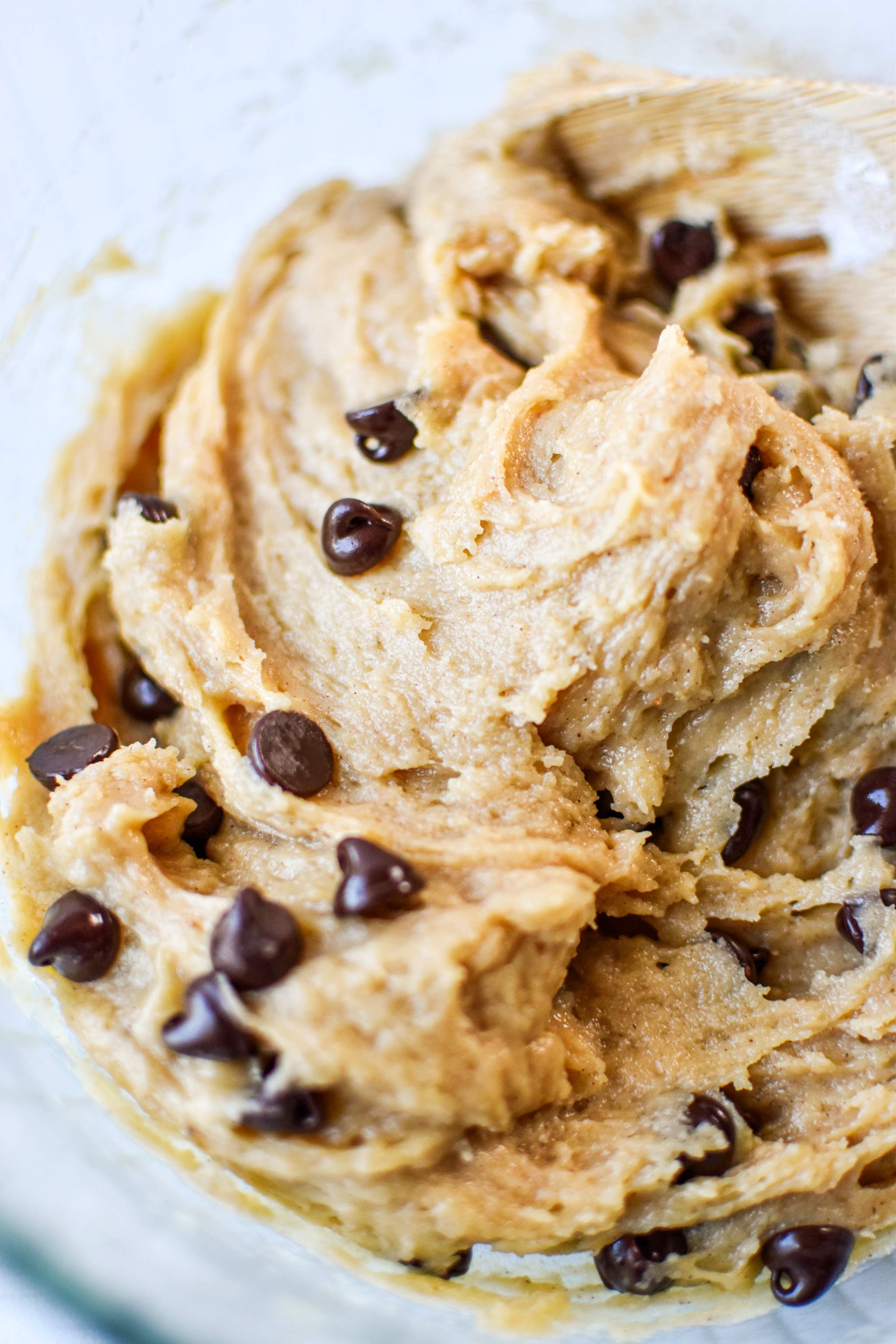 Adding chocolate chips to the dough for the pancake mix cookies