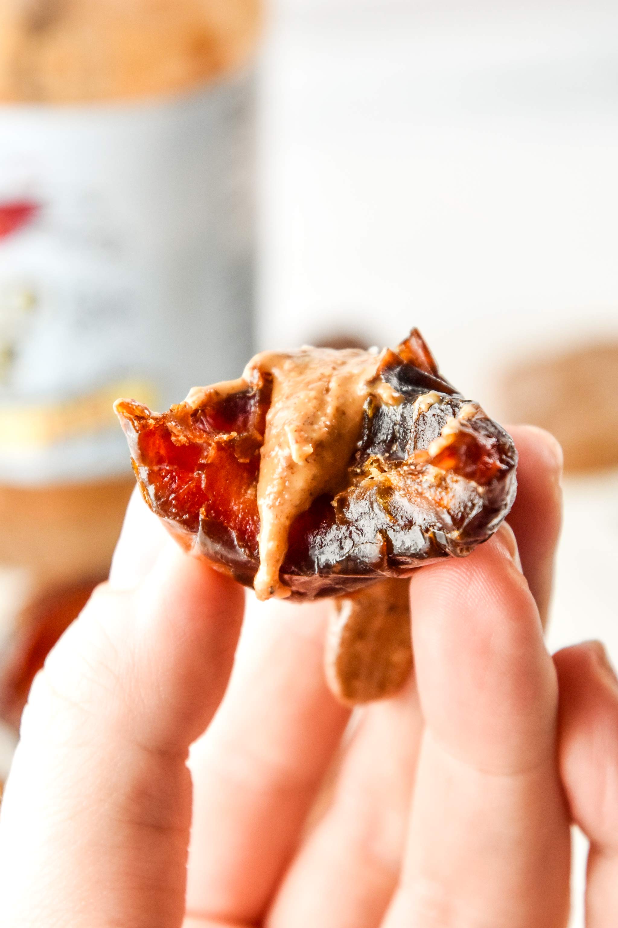 salted almond butter stuffed dates with a bite taken out