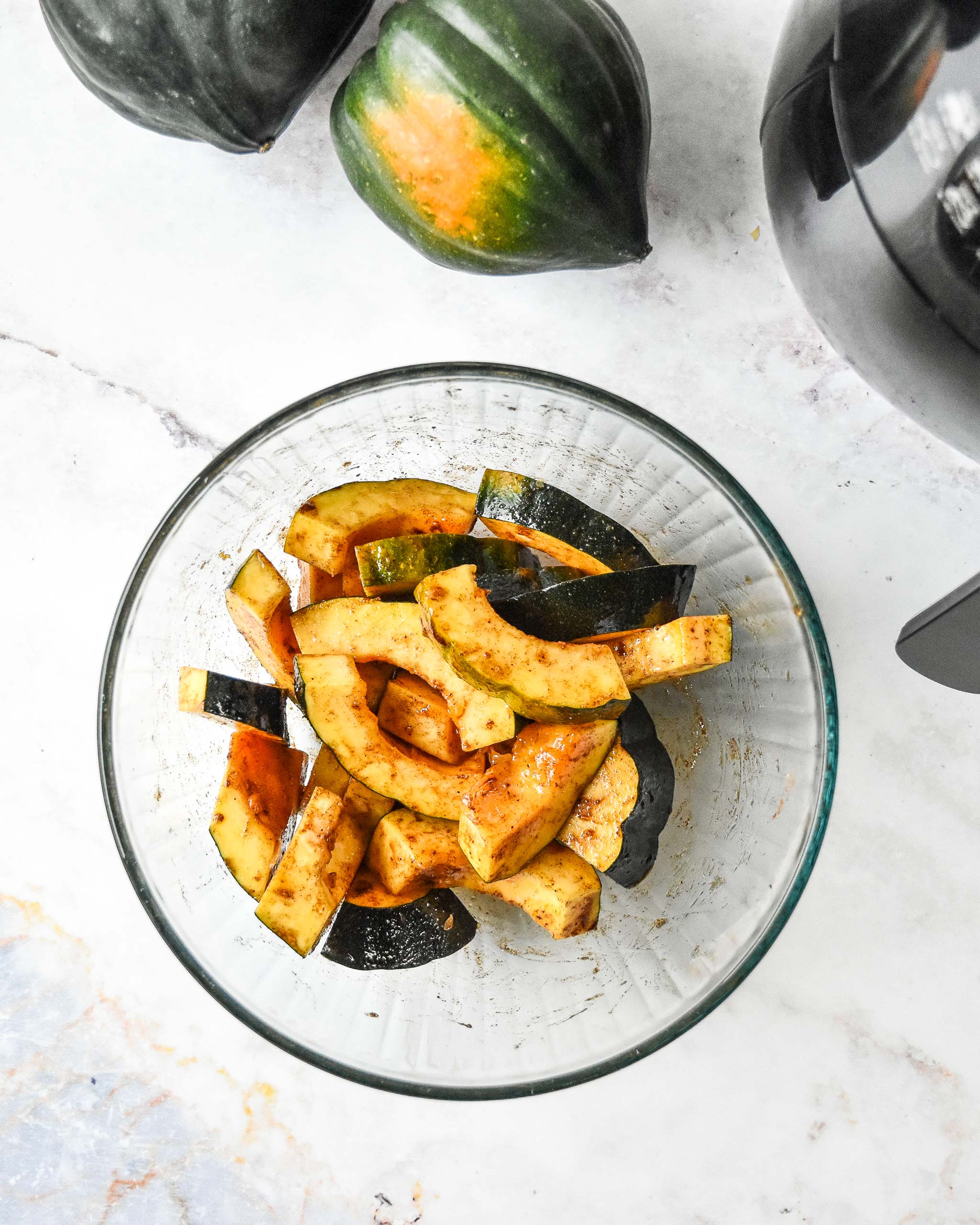 acorn squash with sweet seasonings ready to go in the air fryer