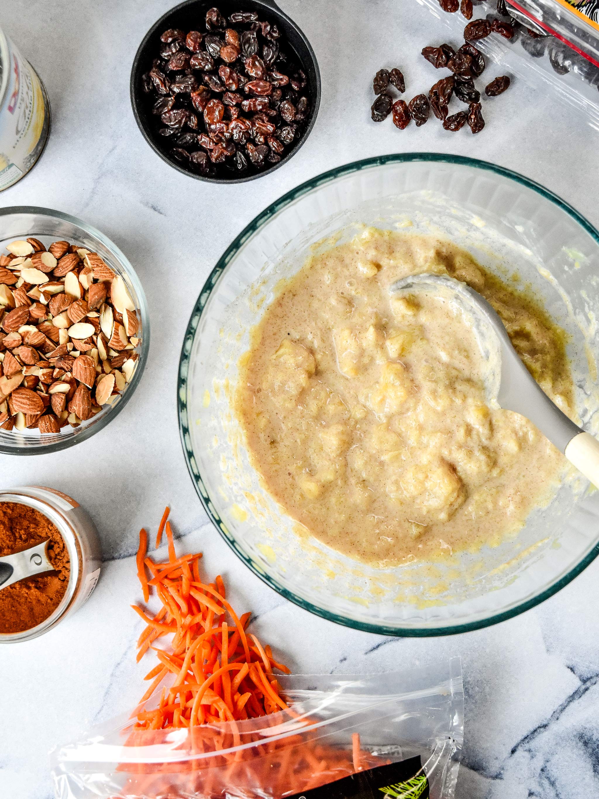 Ingredients for the carrot raisin salad about to be mixed together