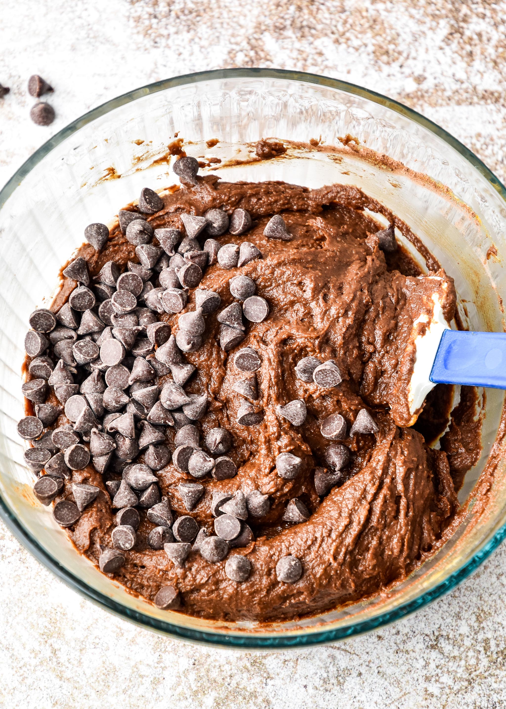 pumpkin spice brownie bites batter with chocolate chips on top