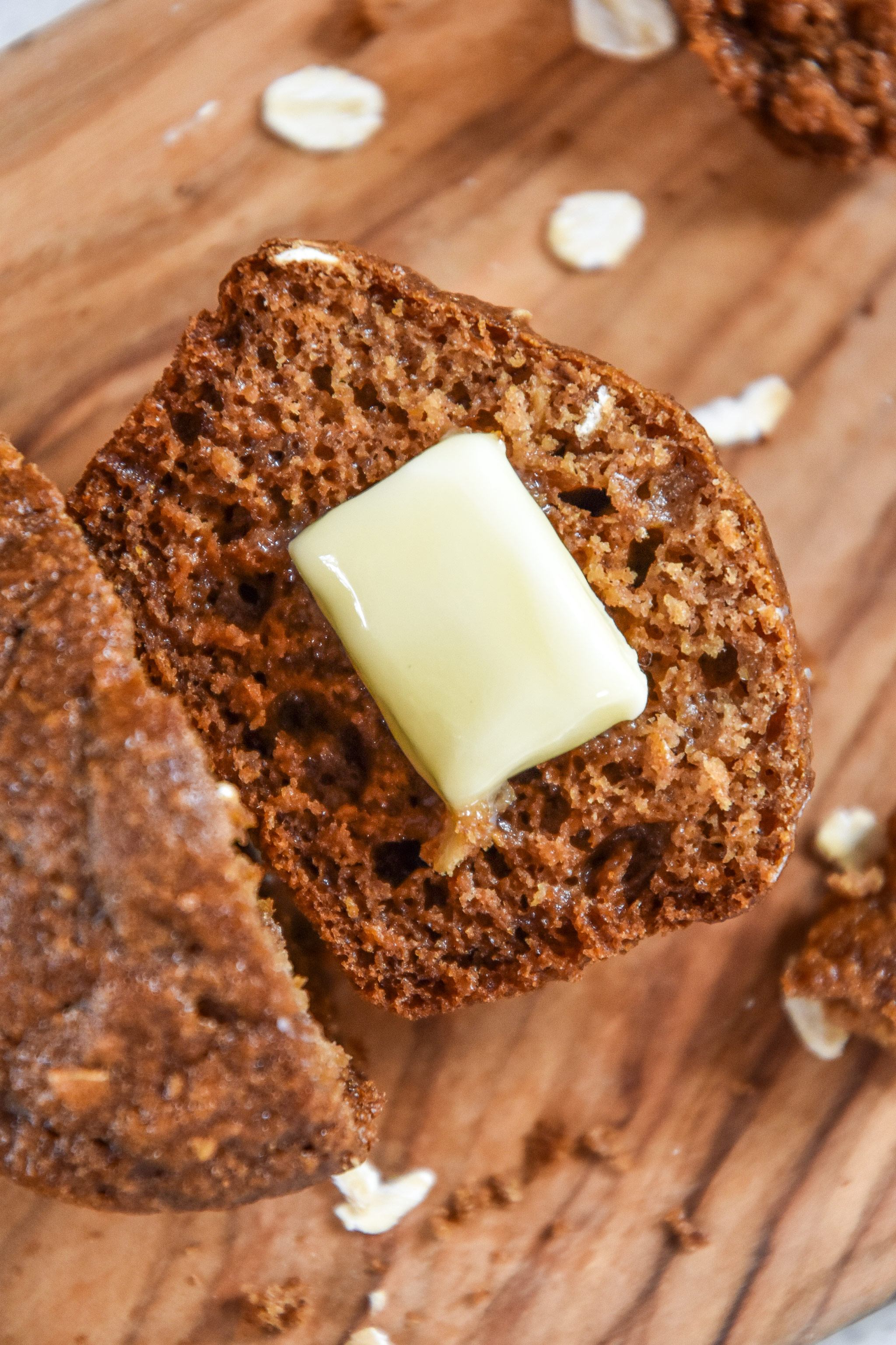 oatmeal applesauce blender muffin cut in half with butter