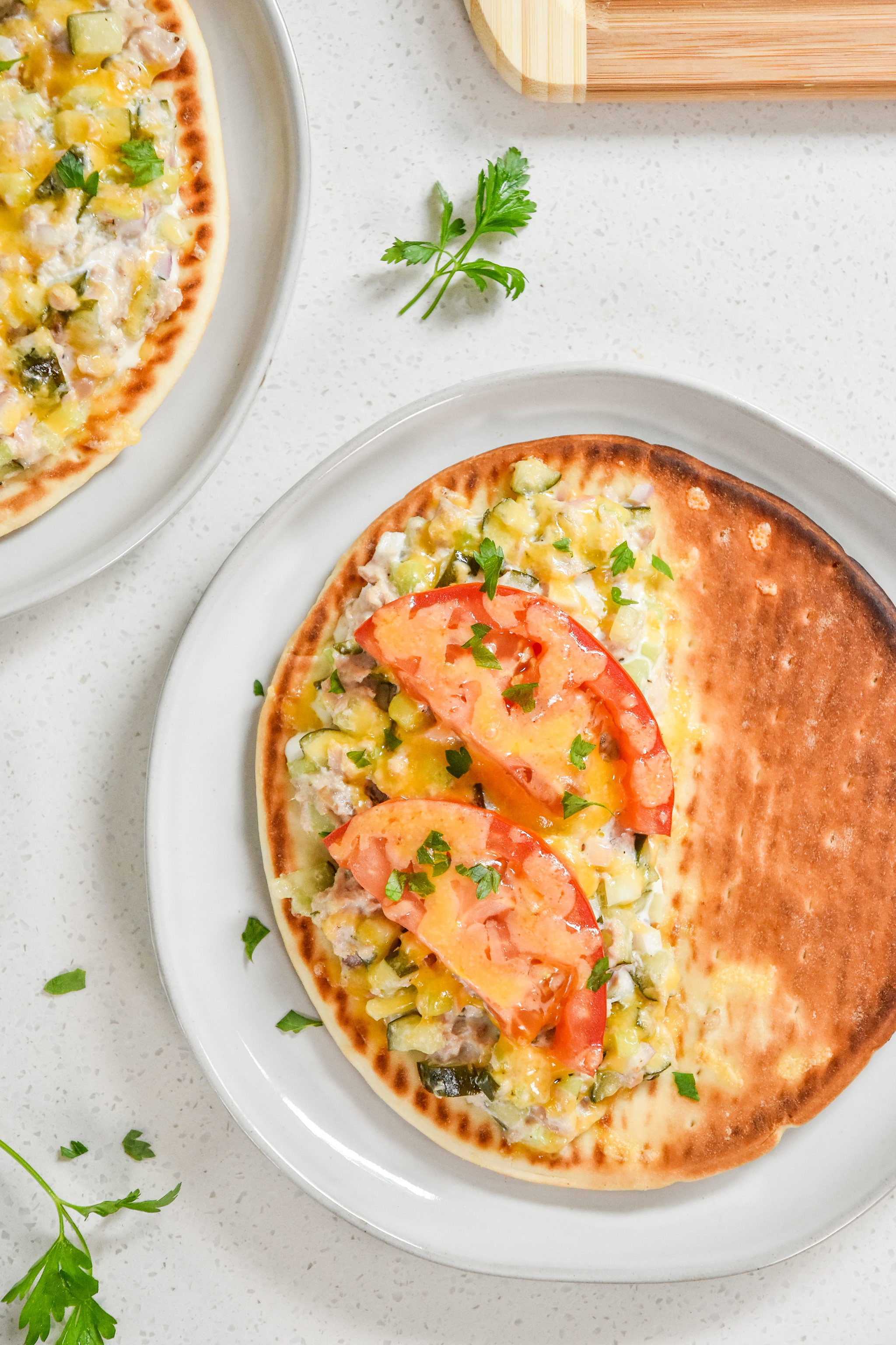 toasted tuna melt pita sandwiches with cheese and garnish fresh from the toaster oven