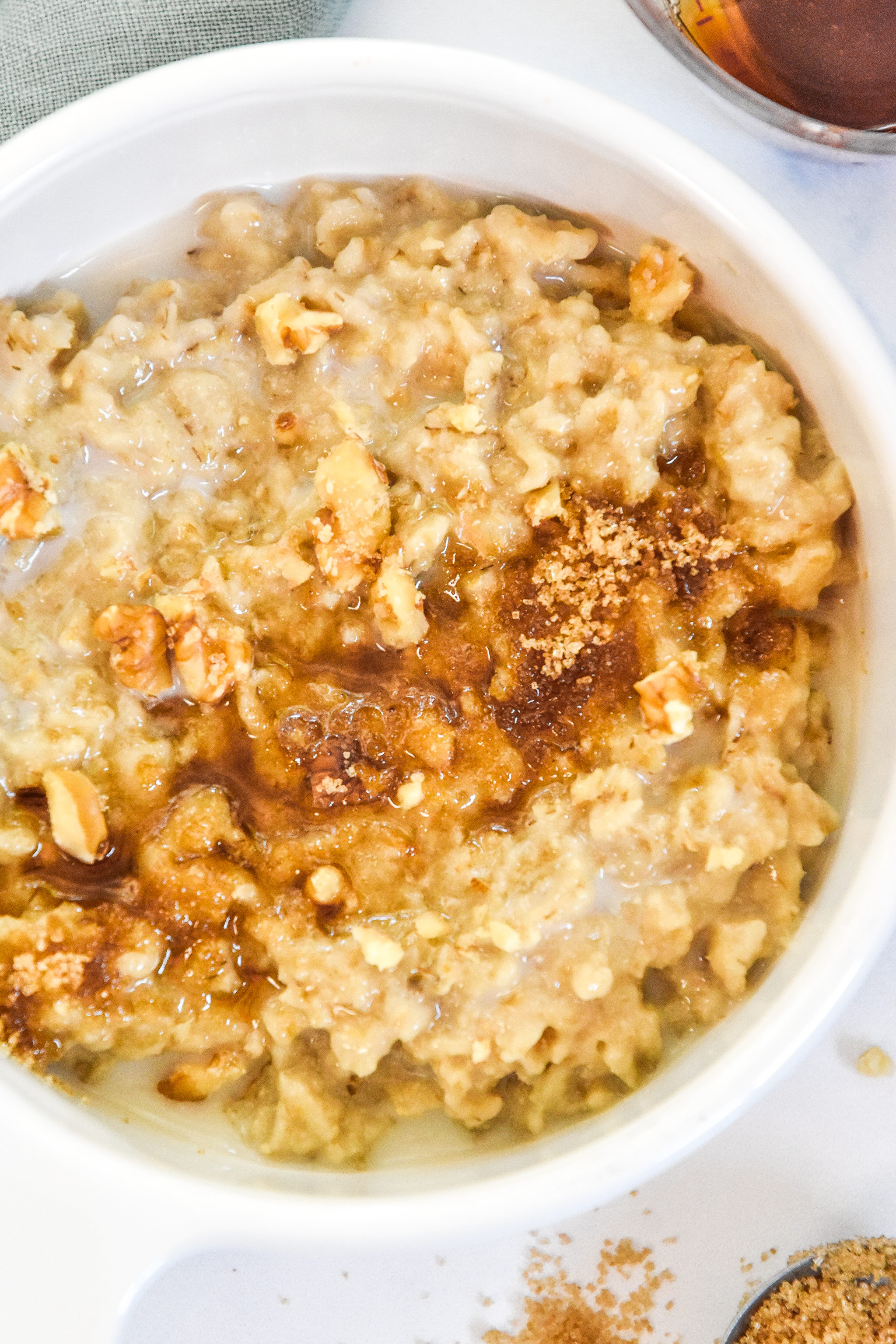 a bowl of instant pot maple brown sugar oatmeal with brown sugar on top