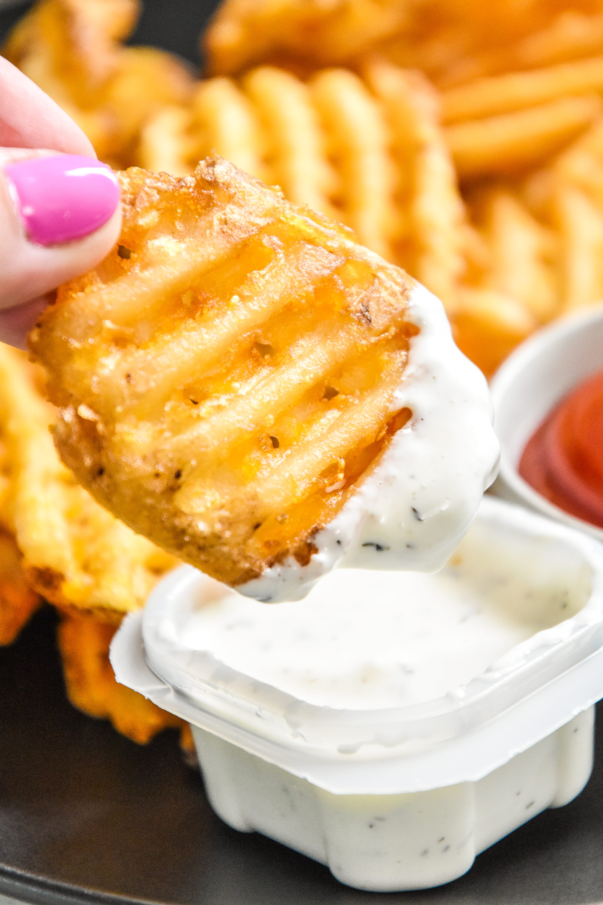 a reheated waffle fry dipped in sauce