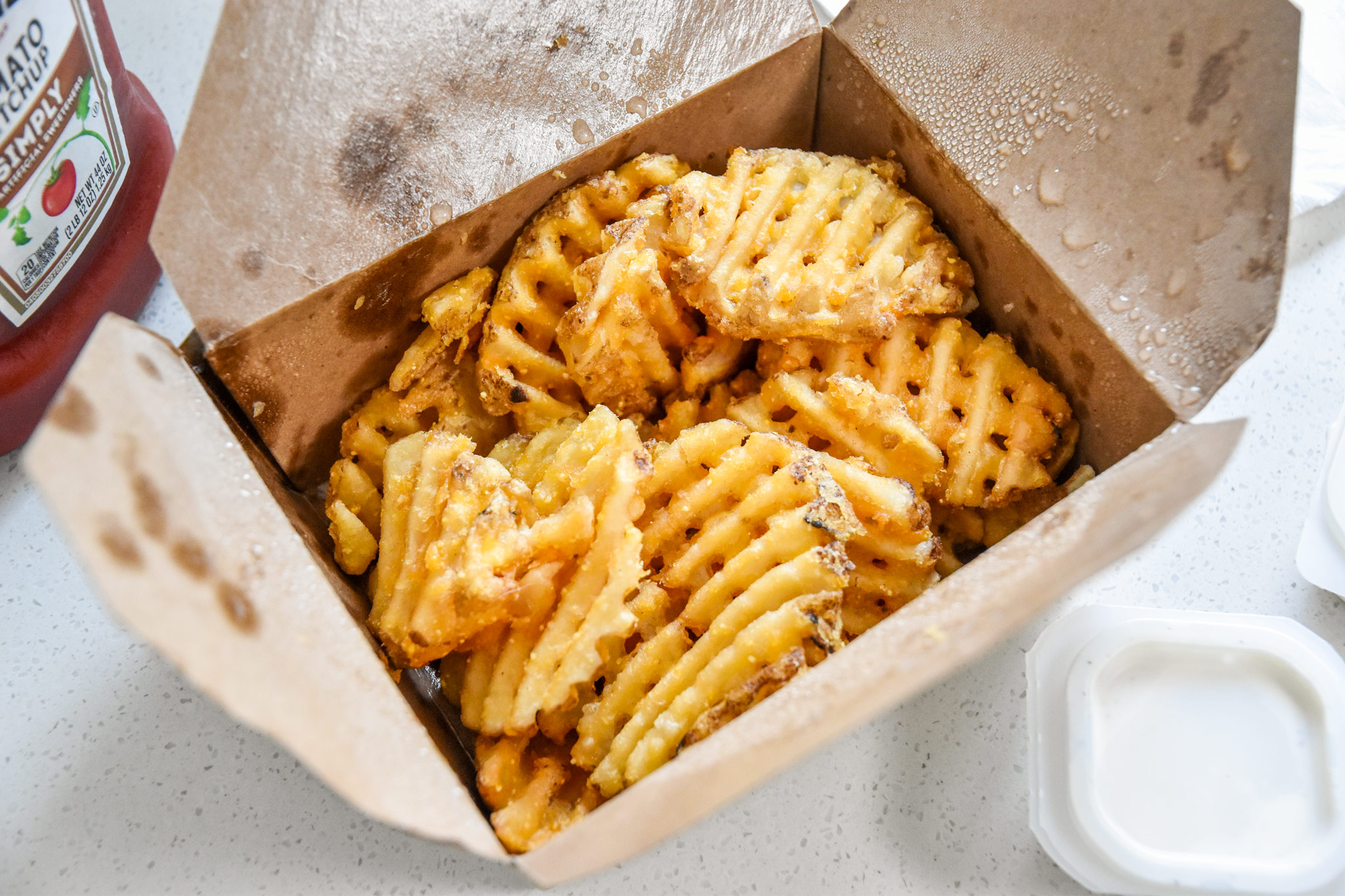 leftover fries in a take out container