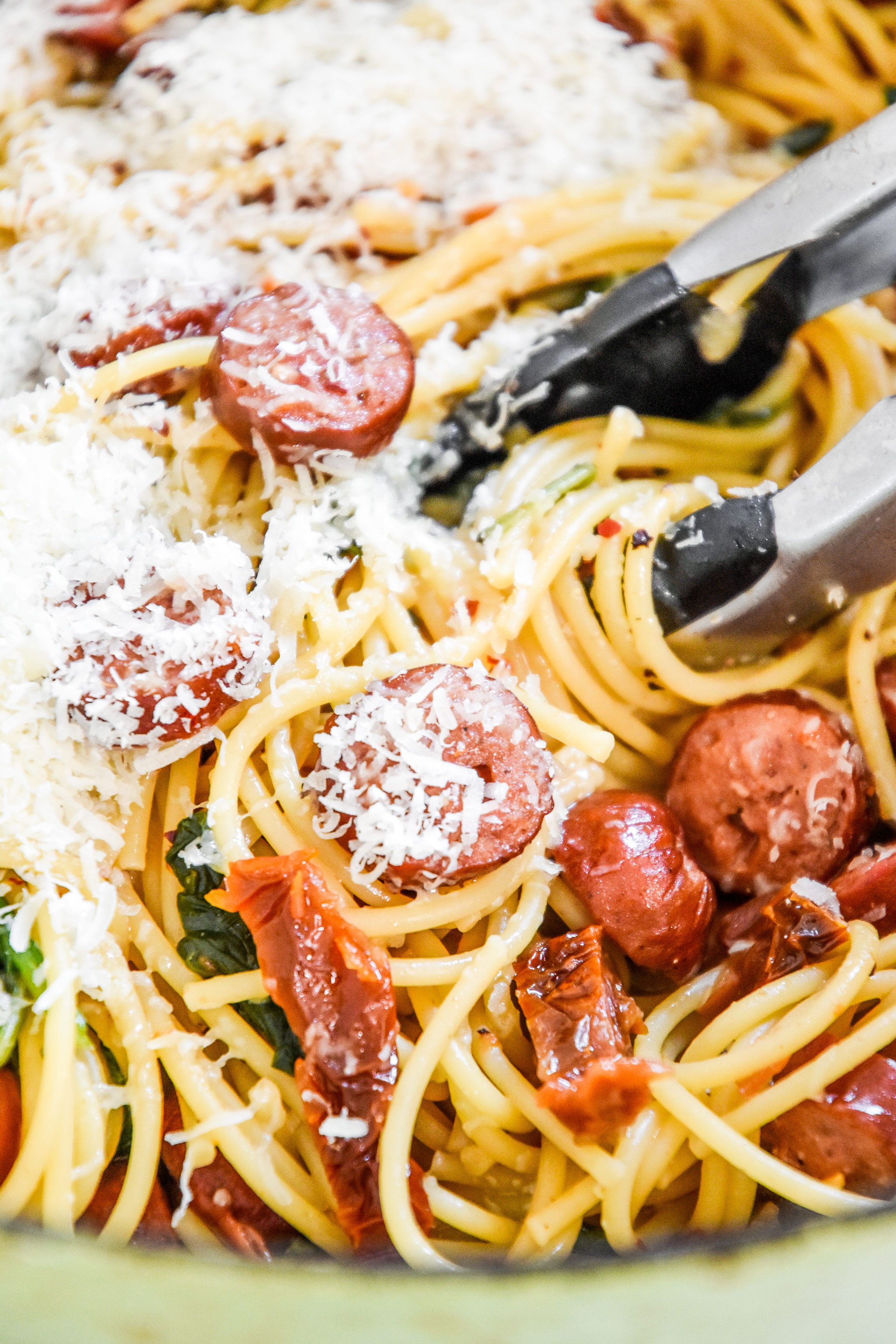 mixing cheese into the pasta