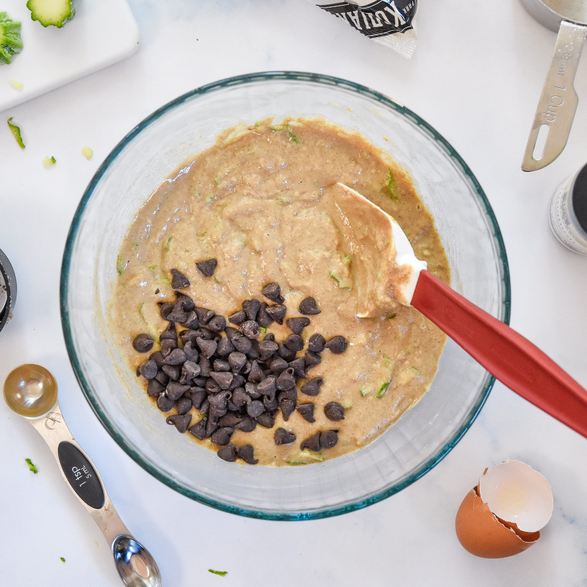 ingredients for the pancake mix zucchini muffins mixed together in a bowl.