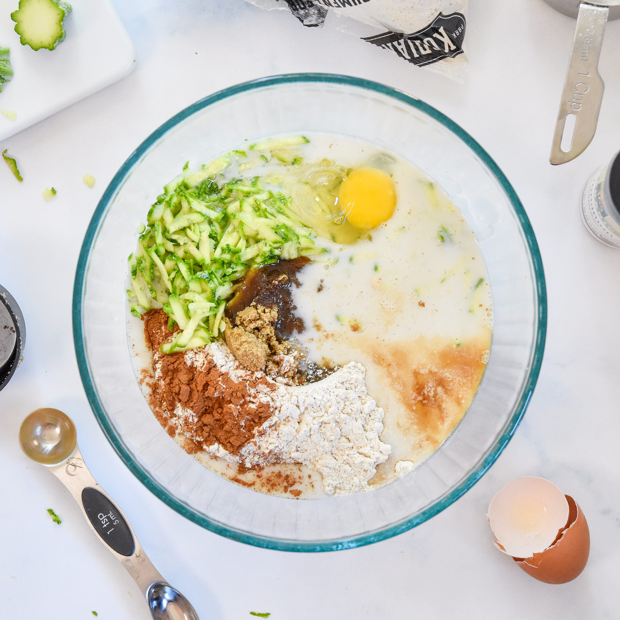 ingredients in a bowl to make pancake mix zucchini muffins.