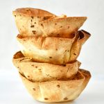 a stack of air fryer flour tortilla bowls.