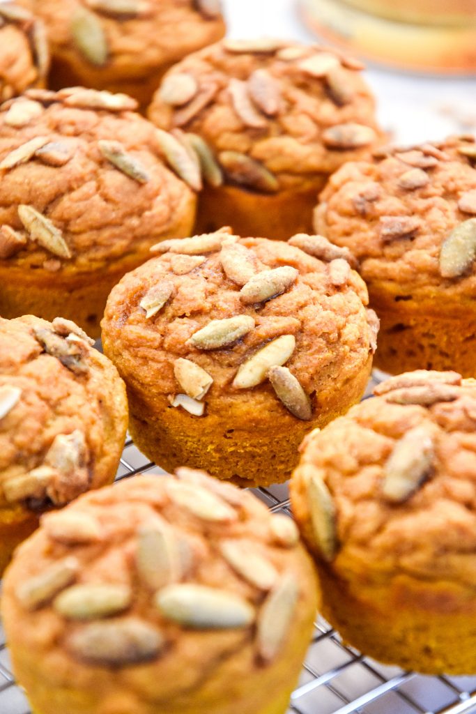pumpkin spice pancake mix muffins on a cooling rack.