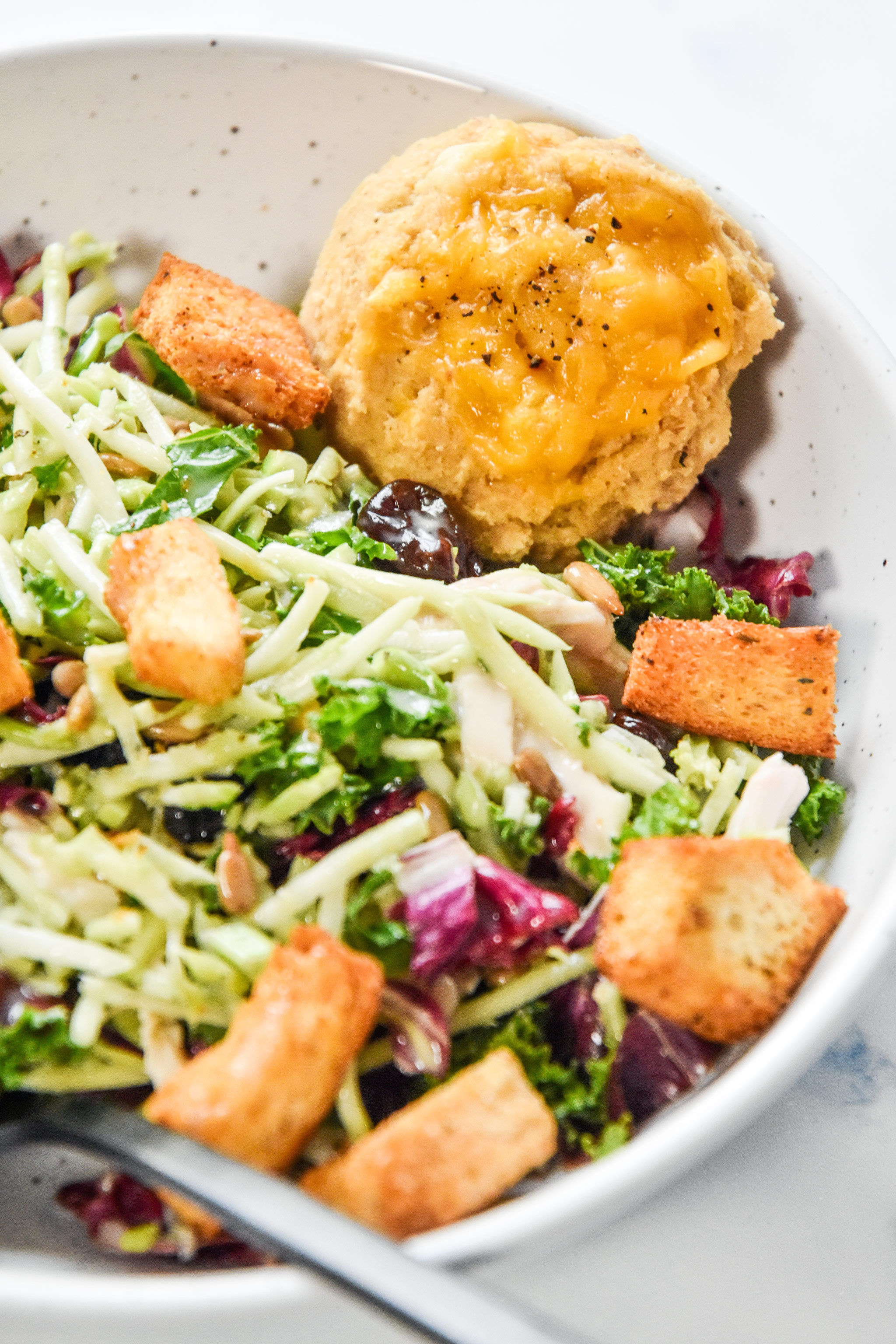 pancake mix cheddar drop biscuit served with a salad.