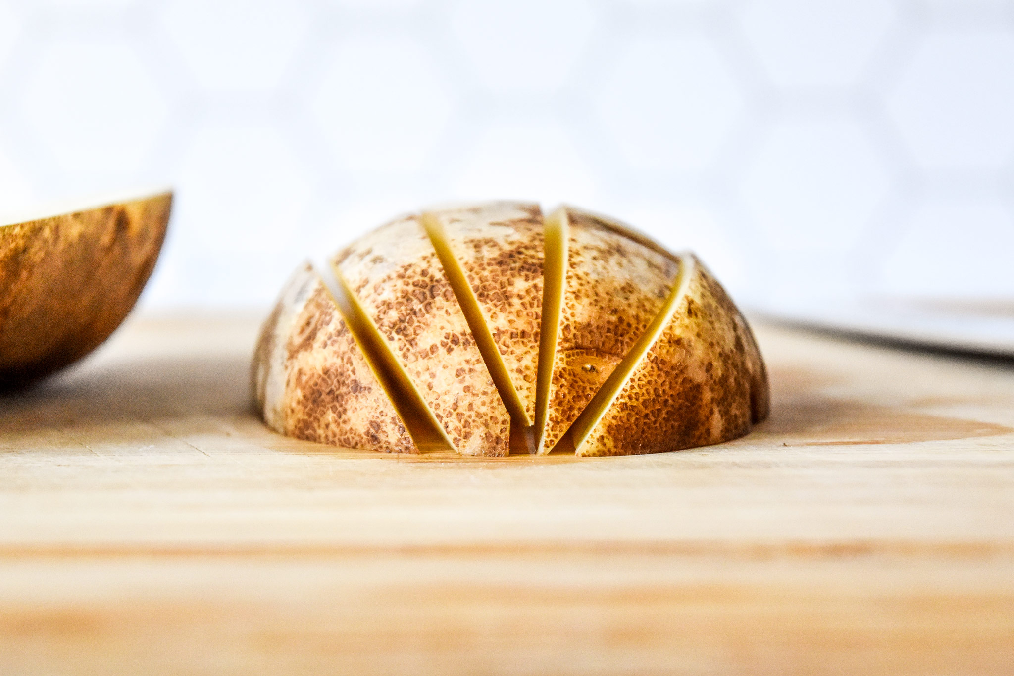 half a potato cut into wedges.