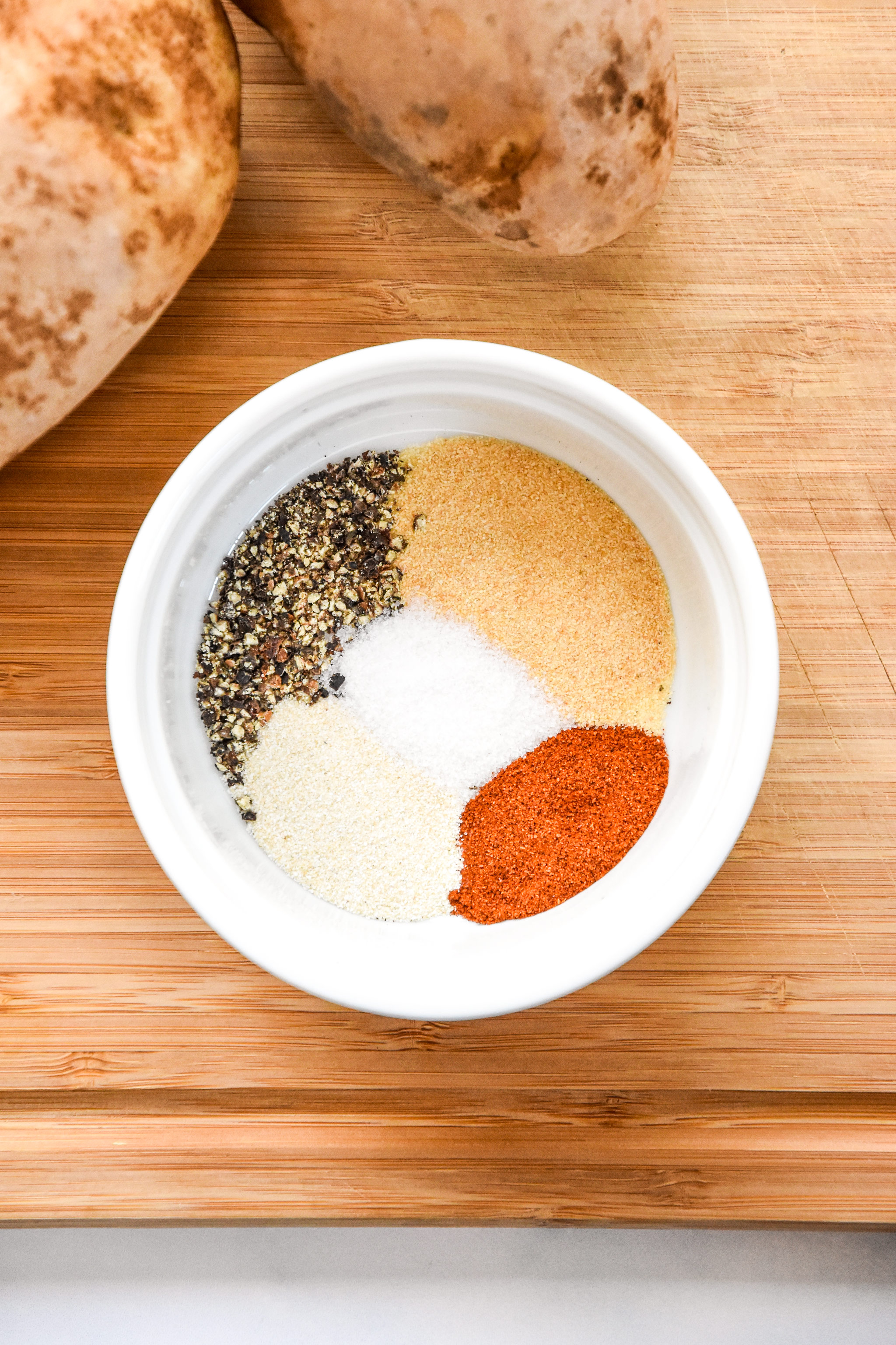 spices in the bowl for the potato wedges.
