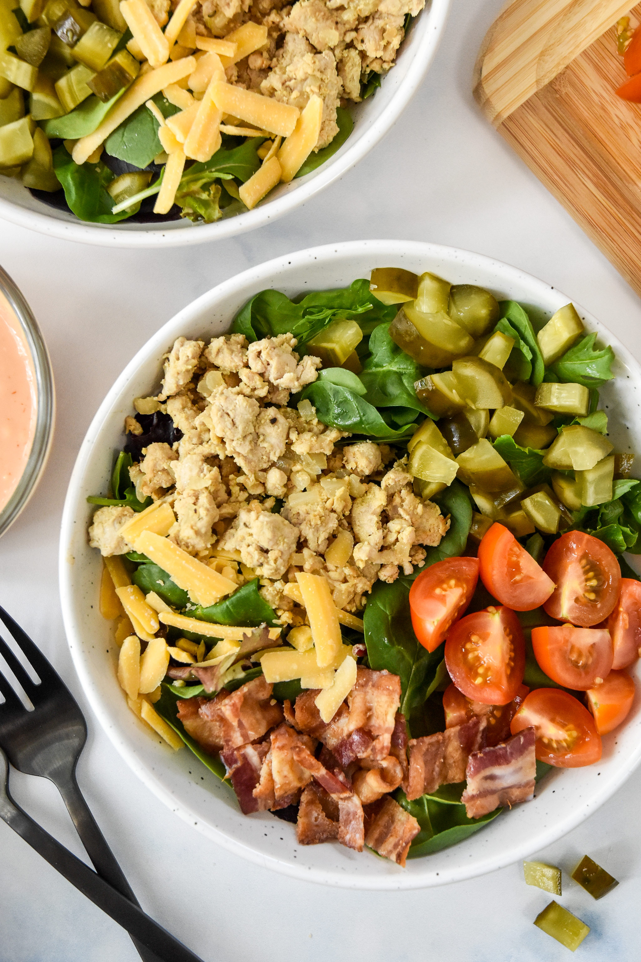 prepared ground turkey burger salad bowl without dressing.
