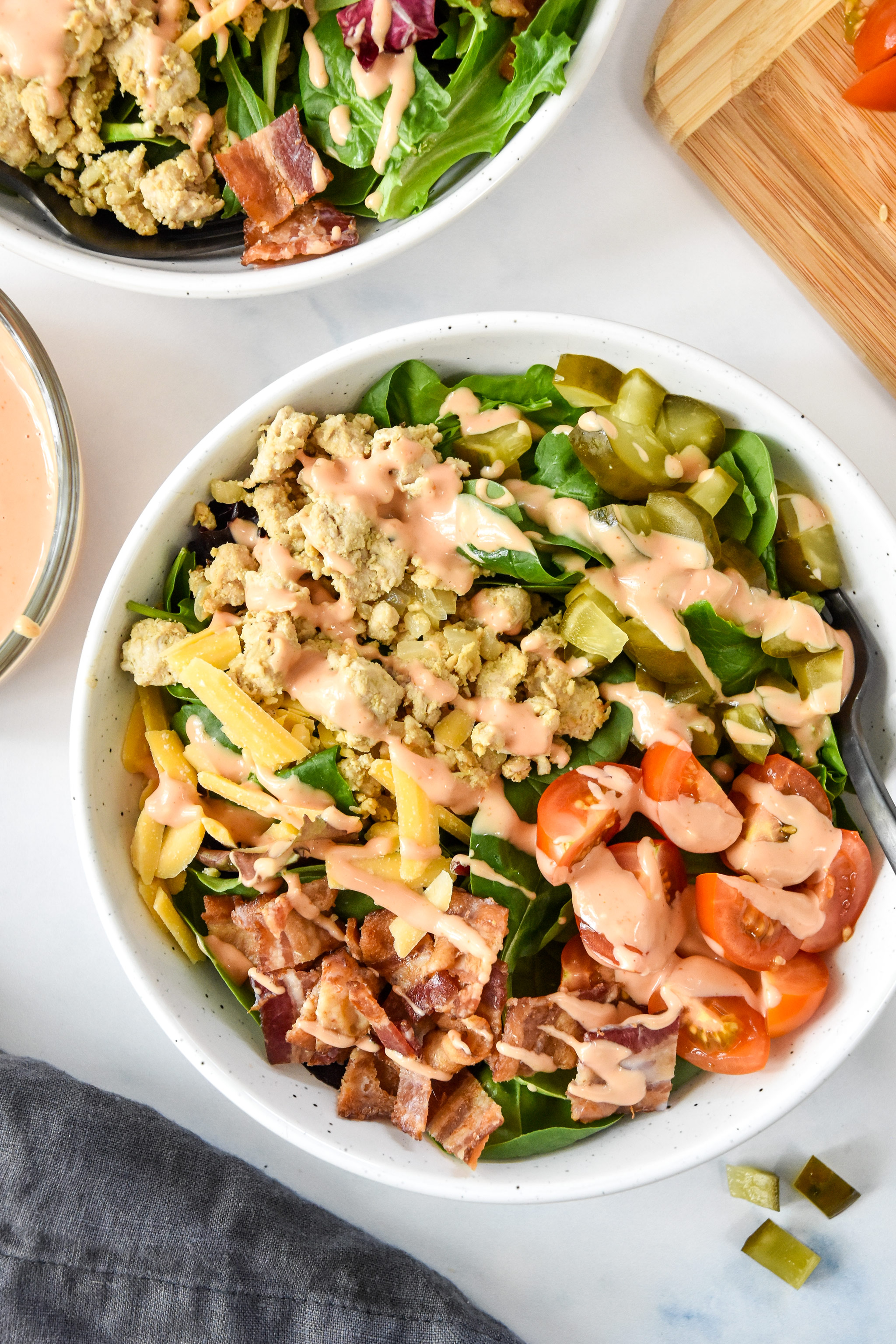 loaded ground turkey burger bowl with dressing.