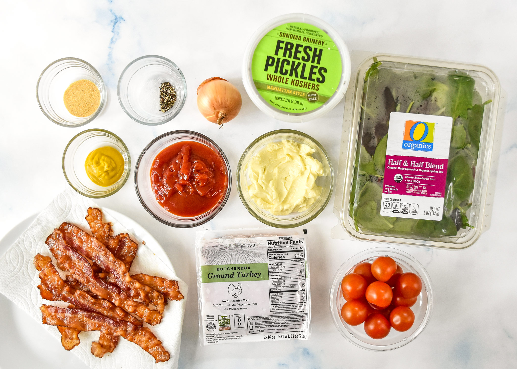 ingredients for the loaded ground turkey burger bowls including bacon, lettuce mayo mustard.