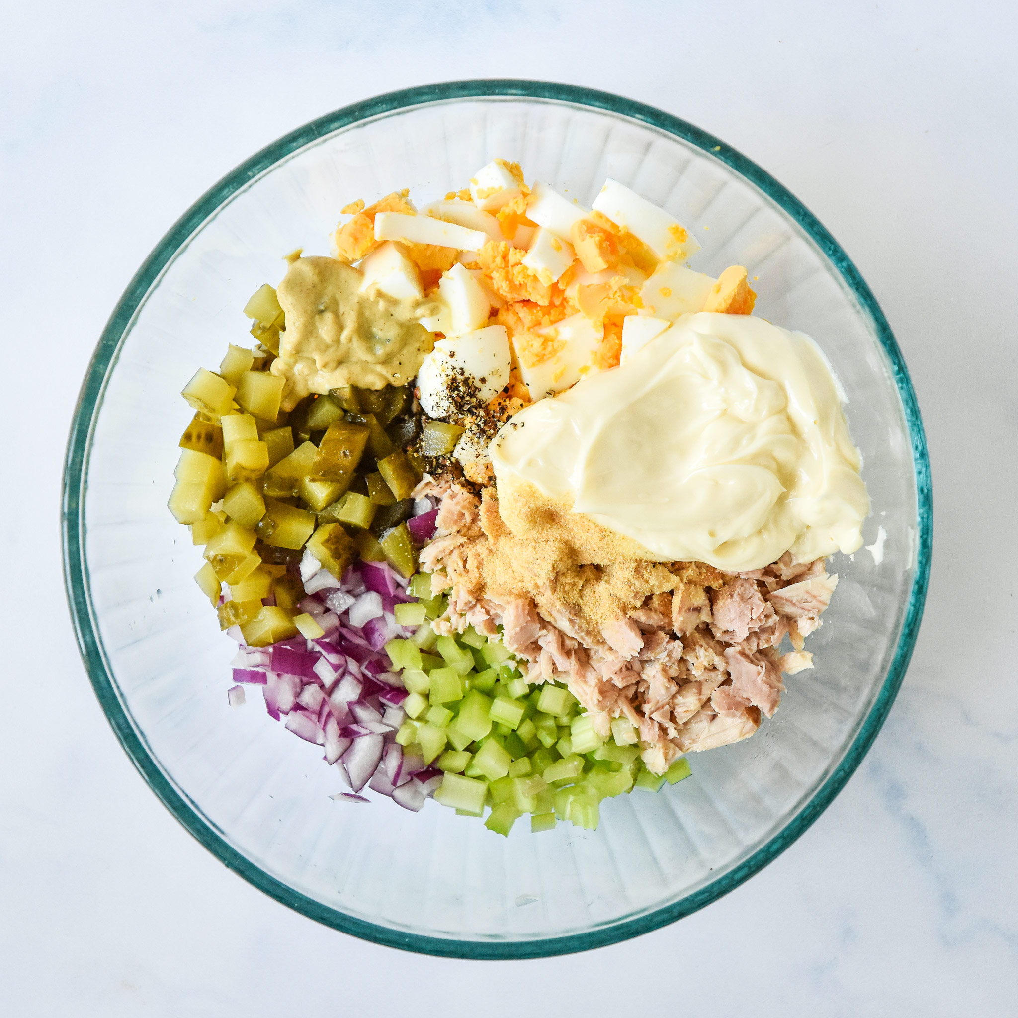 ingredients in the bowl before mixing up for the tuna egg salad.