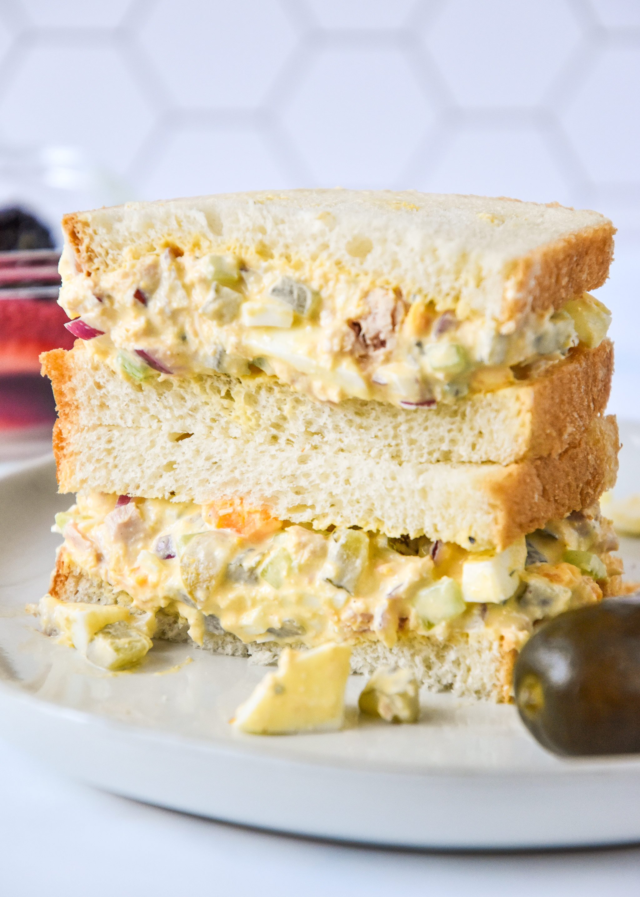 tuna egg salad on white bread cut in half.