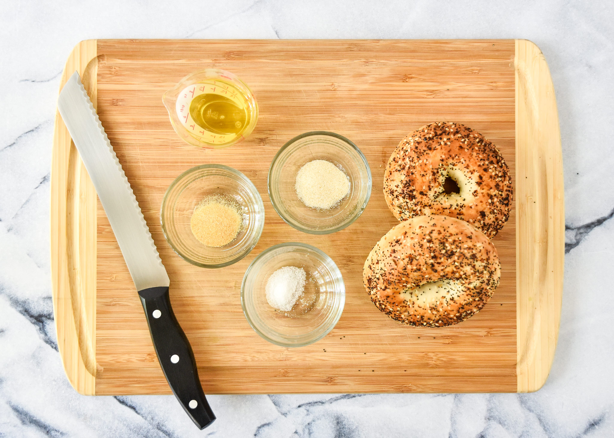 ingredients for the air fryer everything bagel chips on a cutting board.