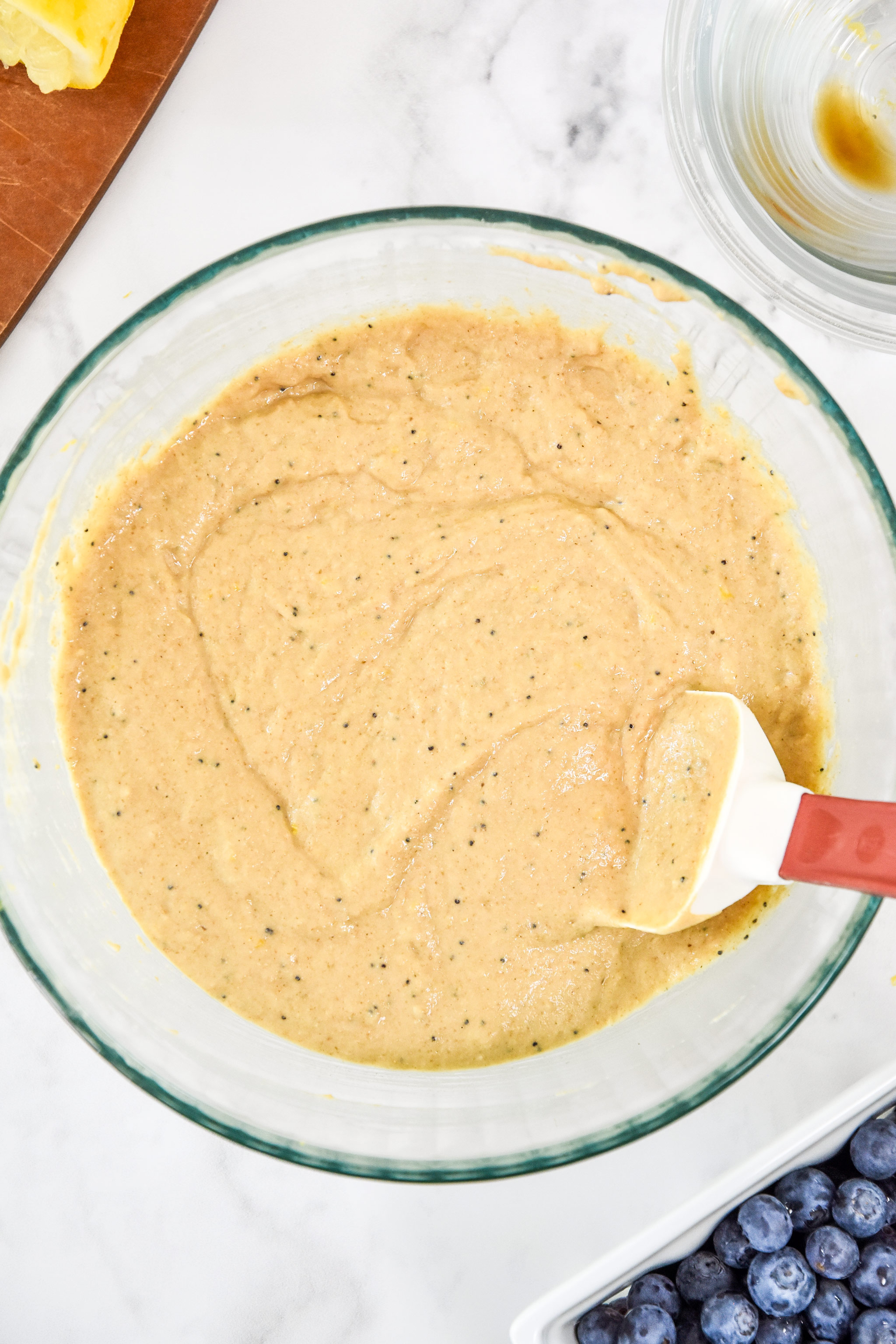 batter for the blueberry lemon pancake mix muffins in a glass bowl.